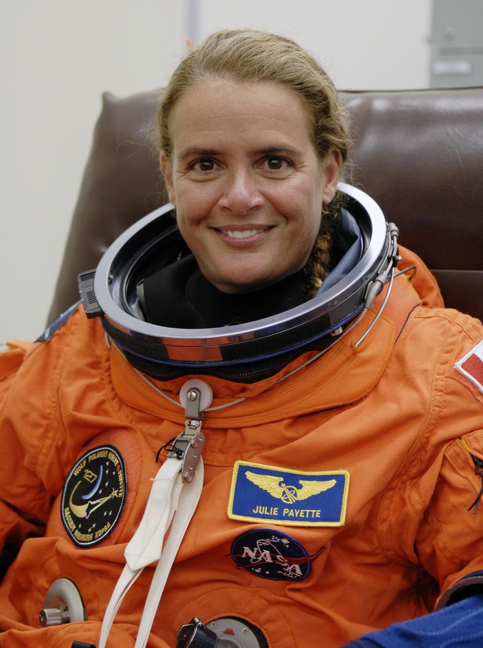 CAPE CANAVERAL, Fla. – – In the Operations and Checkout Building at NASA's Kennedy Space Center in Florida, STS-127 crew members put on their launch-and-entry suits before heading to the Astrovan for the 3.4-mile drive to Launch Pad 39A.  Seen here is Mission Specialist Julie Payette of the Canadian Space Agency, who is making her second shuttle flight. At the pad, Payette and the other crew members will complete their suitup and enter space shuttle Endeavour for the 7:13 p.m. EDT liftoff.  This is the fourth launch attempt for the STS-127 mission. The first two launch attempts on June 13 and June 17 were scrubbed when a hydrogen gas leak occurred during tanking due to a misaligned Ground Umbilical Carrier Plate. Mission managers also decided to delay tanking on July 11 for a launch attempt later in the day to allow engineers and safety personnel time to analyze data captured during lightning strikes near the pad on July 10. Endeavour will deliver the Japanese Experiment Module's Exposed Facility, or JEM-EF, and the Experiment Logistics Module-Exposed Section, or ELM-ES, in the final of three flights dedicated to the assembly of the Japan Aerospace Exploration Agency's Kibo laboratory complex on the International Space Station.  STS-127 is the 29th flight for the assembly of the space station.   Photo credit: NASA/Kim Shiflett