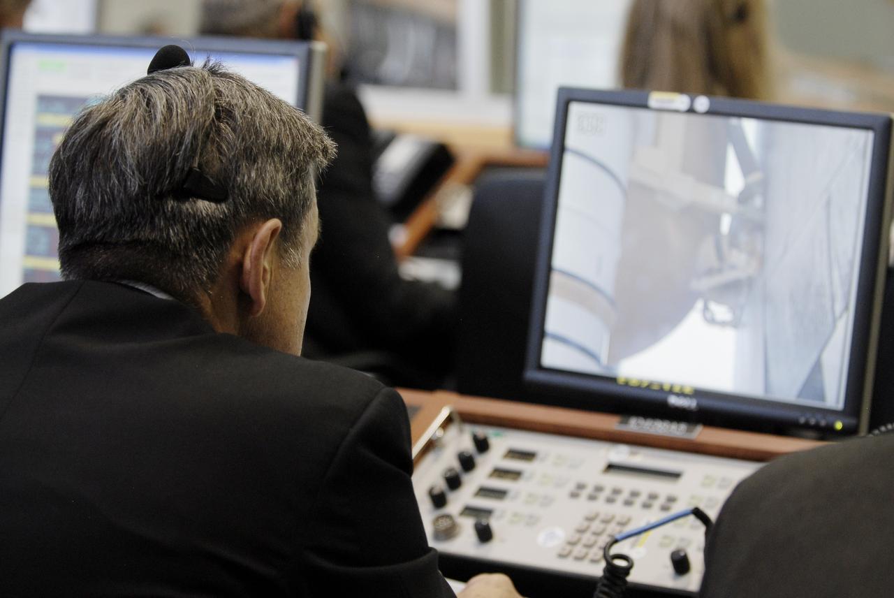CAPE CANAVERAL, Fla. – From the Launch Control Center at NASA's Kennedy Space Center in Florida, Center Director Bob Cabana watches the monitor with space shuttle Endeavour on Launch Pad 39A. The launch of space shuttle Endeavour on the STS-127 mission was scrubbed at 7:02 p.m. EDT due to weather conditions near the Shuttle Landing Facility at Kennedy that violated rules for launching. The runway would be needed in the unlikely event that Endeavour would have to make an emergency landing back at Kennedy. Launch was rescheduled for July 13 at 6:51 p.m. EDT. Photo credit: NASA/ Kim Shiflett