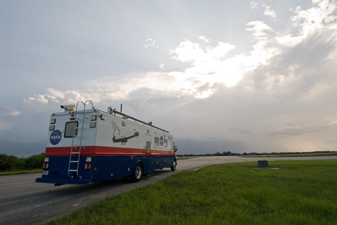 CAPE CANAVERAL, Fla. – The convoy command vehicle waits at the Shuttle Landing Facility at NASA's Kennedy Space Center in Florida in the event of a return-to-landing-site is needed after launch of space shuttle Endeavour on the STS-127 mission. This is the fourth launch attempt for the STS-127 mission. The first two launch attempts on June 13 and June 17 were scrubbed when a hydrogen gas leak occurred during tanking due to a misaligned Ground Umbilical Carrier Plate. Mission managers also decided to delay tanking on July 11 for a launch attempt later in the day to allow engineers and safety personnel time to analyze data captured during lightning strikes near the pad on July 10. Endeavour will deliver the Japanese Experiment Module's Exposed Facility, or JEM-EF, and the Experiment Logistics Module-Exposed Section, or ELM-ES, in the final of three flights dedicated to the assembly of the Japan Aerospace Exploration Agency's Kibo laboratory complex on the International Space Station.  STS-127 is the 29th flight for the assembly of the space.   Photo credit: NASA/Jack Pfaller