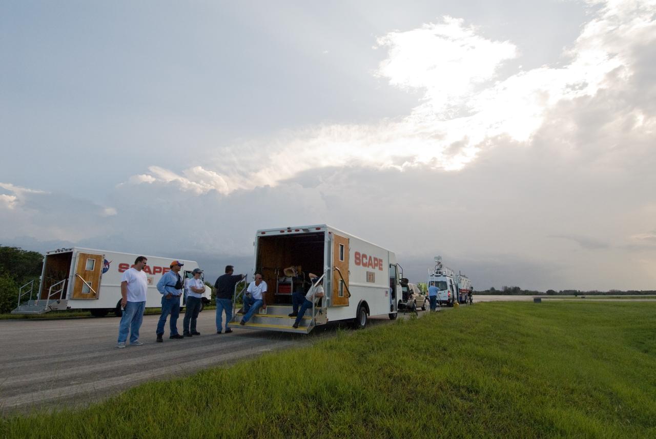 CAPE CANAVERAL, Fla. – SCAPE vehicles are in position at the Shuttle Landing Facility at NASA's Kennedy Space Center in Florida in the event of a return-to-landing-site is needed after launch of space shuttle Endeavour on the STS-127 mission. This is the fourth launch attempt for the STS-127 mission. The first two launch attempts on June 13 and June 17 were scrubbed when a hydrogen gas leak occurred during tanking due to a misaligned Ground Umbilical Carrier Plate. Mission managers also decided to delay tanking on July 11 for a launch attempt later in the day to allow engineers and safety personnel time to analyze data captured during lightning strikes near the pad on July 10. Endeavour will deliver the Japanese Experiment Module's Exposed Facility, or JEM-EF, and the Experiment Logistics Module-Exposed Section, or ELM-ES, in the final of three flights dedicated to the assembly of the Japan Aerospace Exploration Agency's Kibo laboratory complex on the International Space Station.  STS-127 is the 29th flight for the assembly of the space.   Photo credit: NASA/Jack Pfaller