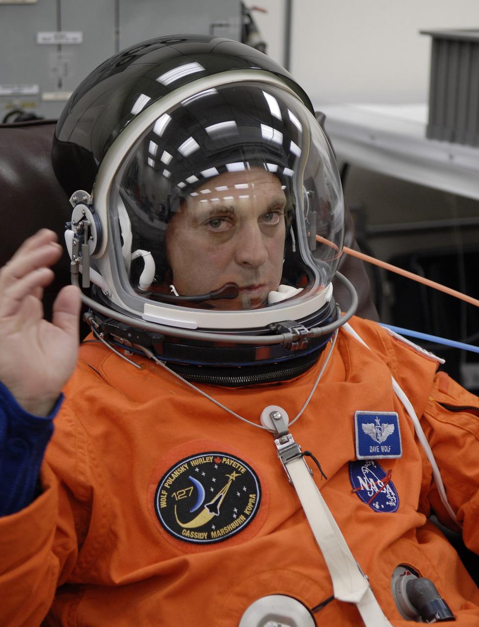 CAPE CANAVERAL, Fla. – In the Operations and Checkout Building at NASA's Kennedy Space Center in Florida, STS-127 Mission Specialist Dave Wolf checks the communication inside his helmet before heading to Launch Pad 39A for launch on space shuttle Endeavour. Liftoff is scheduled for 6:51 p.m. EDT. Today's launch will be the fifth attempt. The mission was scrubbed on June 13 and again June 17 when a hydrogen gas leak occurred during tanking due to a misaligned Ground Umbilical Carrier Plate. The mission was scrubbed July 12 due to weather conditions near the Shuttle Landing Facility at Kennedy that violated rules for launching. Endeavour will deliver the Japanese Experiment Module's Exposed Facility, or JEM-EF, and the Experiment Logistics Module-Exposed Section, or ELM-ES, in the final of three flights dedicated to the assembly of the Japan Aerospace Exploration Agency's Kibo laboratory complex on the International Space Station. STS-127 is the 29th flight for the assembly of the space station. Photo credit: NASA/ Kim Shiflett