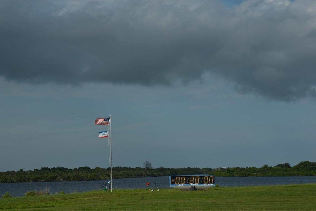 CAPE CANAVERAL, Fla. – Black clouds roll across the Launch Complex 39 Area and NASA News Center at NASA's Kennedy Space Center in Florida.  NASA managers postponed today’s space shuttle launch because of lightning and thunderstorms within the 20-nautical-mile circle around the launch pad. The fifth launch attempt for the STS-127 mission was scrubbed at 6:39 p.m. EDT. The first two launch attempts on June 13 and June 17 were scrubbed when a hydrogen gas leak occurred during tanking due to a misaligned Ground Umbilical Carrier Plate. Mission managers also decided to delay tanking on July 11 for a launch attempt later in the day to allow engineers and safety personnel time to analyze data captured during lightning strikes near the pad on July 10. Weather concerns caused a scrub July 12 as well. Endeavour will deliver the Japanese Experiment Module's Exposed Facility, or JEM-EF, and the Experiment Logistics Module-Exposed Section, or ELM-ES, in the final of three flights dedicated to the assembly of the Japan Aerospace Exploration Agency's Kibo laboratory complex on the International Space Station.  STS-127 is the 29th flight for the assembly of the space.    Photo credit: NASA/Tim Jacobs