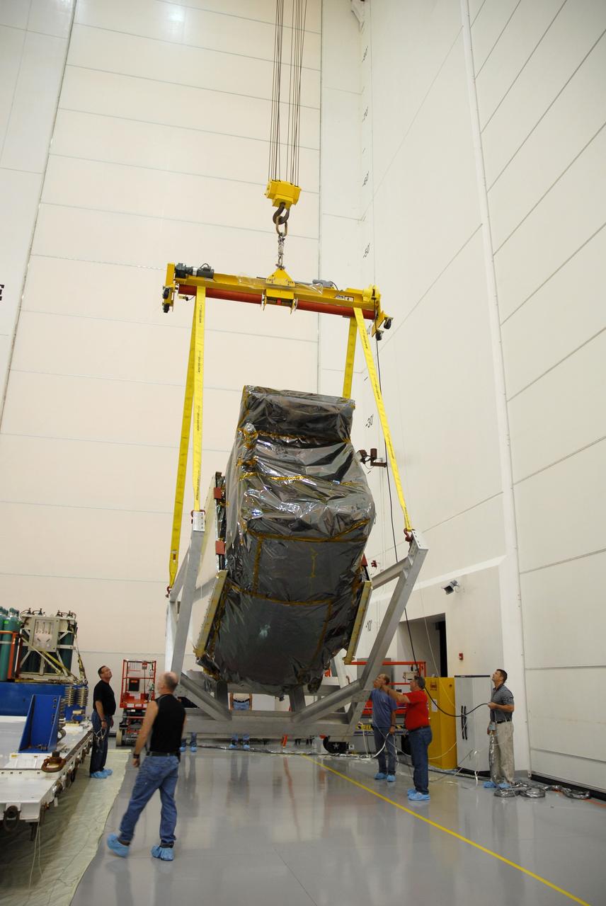 CAPE CANAVERAL, Fla. – At Astrotech Space Operations in Titusville, Fla., workers ensure the smooth rotation of NASA's Solar Dynamics Observatory, or SDO.  After rotation, the SDO will be moved to a work stand.  SDO is the first space weather research network mission in NASA's Living With a Star Program.  The spacecraft's long-term measurements will give solar scientists in-depth information about changes in the sun's magnetic field and insight into how they affect Earth.  In preparation for its anticipated November launch, engineers will perform a battery of comprehensive tests to ensure SDO can withstand the stresses and vibrations of the launch itself, as well as what it will encounter in the space environment after launch.   Photo credit: NASA/Cory Huston