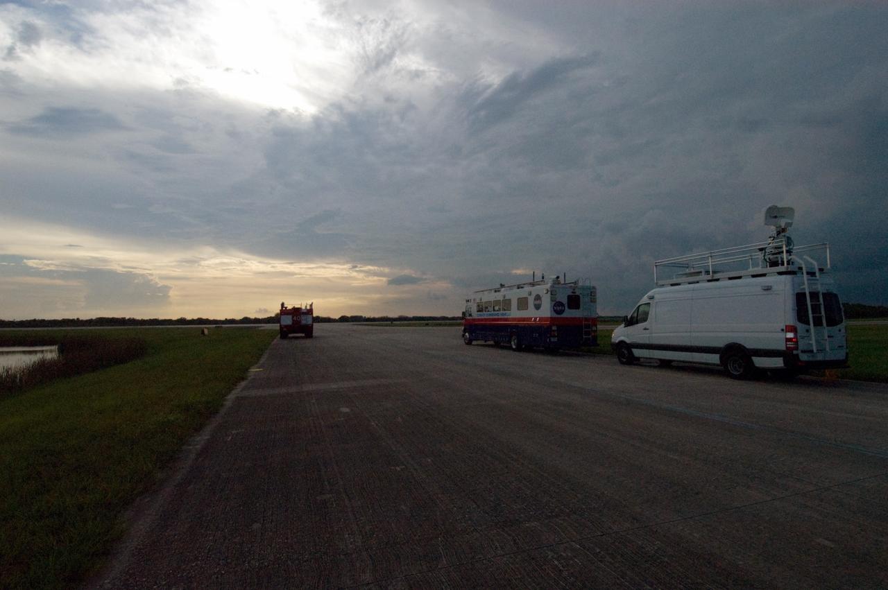 CAPE CANAVERAL, Fla. – The convoy command and SCAPE vehicles are in position at the Shuttle Landing Facility at NASA's Kennedy Space Center in Florida in the event of a return-to-landing-site is needed after launch of space shuttle Endeavour on the STS-127 mission.  NASA managers postponed today’s space shuttle launch because of lightning and thunderstorms within the 20-nautical-mile circle around the launch pad. The fifth launch attempt for the STS-127 mission was scrubbed at 6:39 p.m. EDT. The first two launch attempts on June 13 and June 17 were scrubbed when a hydrogen gas leak occurred during tanking due to a misaligned Ground Umbilical Carrier Plate. Mission managers also decided to delay tanking on July 11 for a launch attempt later in the day to allow engineers and safety personnel time to analyze data captured during lightning strikes near the pad on July 10. The fourth attempt on July 12 was scrubbed due to weather concerns as well. Photo credit: NASA/Chuck Tintera