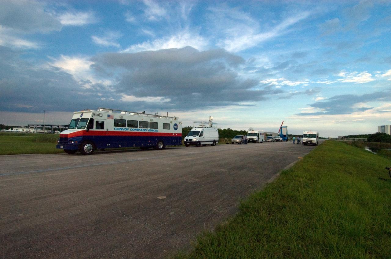 CAPE CANAVERAL, Fla. – As clouds begin to gather over the Shuttle Landing Facility at NASA's Kennedy Space Center in Florida, the convoy command and SCAPE vehicles are in position in the event of a return-to-landing-site is needed after launch of space shuttle Endeavour on the STS-127 mission.  NASA managers postponed today’s space shuttle launch because of lightning and thunderstorms within the 20-nautical-mile circle around the launch pad. The fifth launch attempt for the STS-127 mission was scrubbed at 6:39 p.m. EDT. The first two launch attempts on June 13 and June 17 were scrubbed when a hydrogen gas leak occurred during tanking due to a misaligned Ground Umbilical Carrier Plate. Mission managers also decided to delay tanking on July 11 for a launch attempt later in the day to allow engineers and safety personnel time to analyze data captured during lightning strikes near the pad on July 10. The fourth attempt on July 12 was scrubbed due to weather concerns as well. Photo credit: NASA/Chuck Tintera