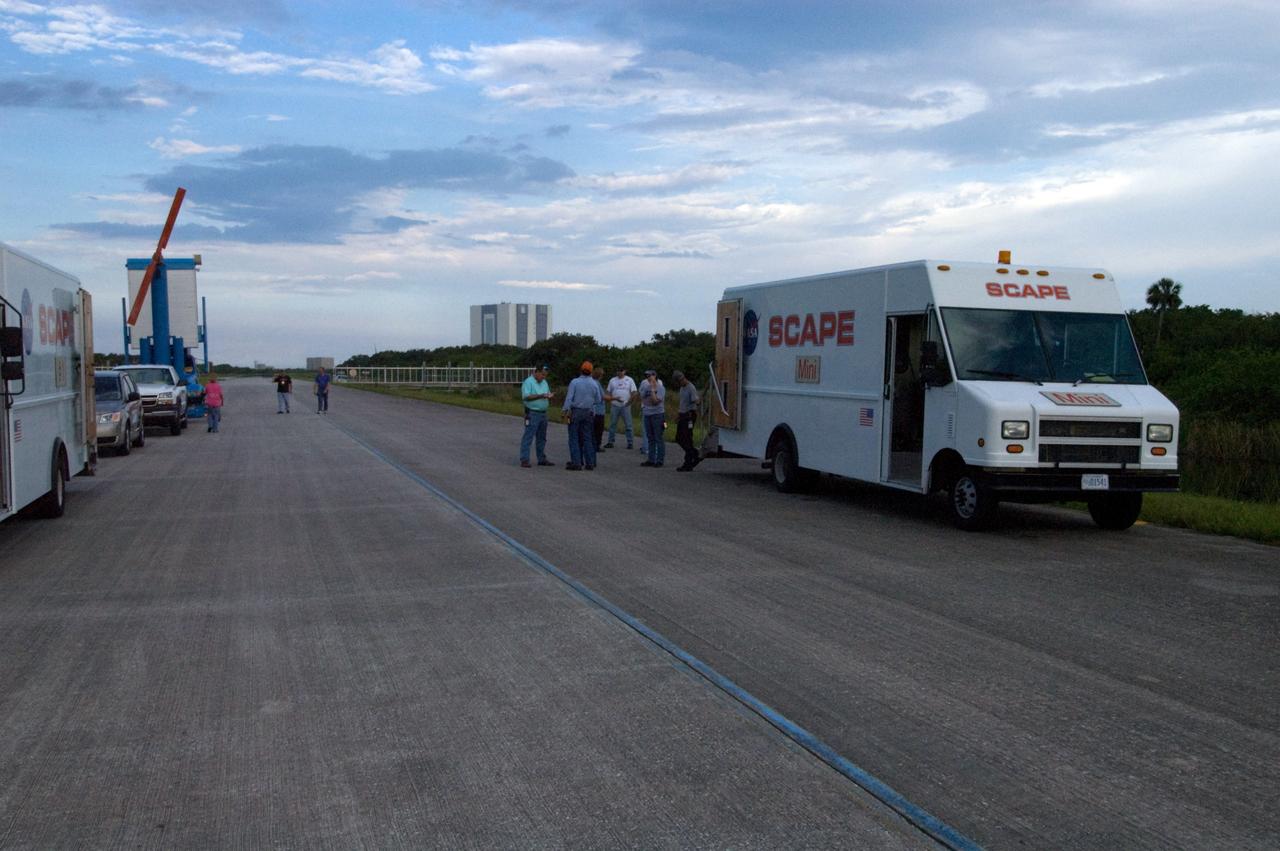 CAPE CANAVERAL, Fla. – As clouds begin to gather over the Shuttle Landing Facility at NASA's Kennedy Space Center in Florida,  SCAPE vehicles and personnel are in position in the event of a return-to-landing-site is needed after launch of space shuttle Endeavour on the STS-127 mission.  NASA managers postponed today’s space shuttle launch because of lightning and thunderstorms within the 20-nautical-mile circle around the launch pad. The fifth launch attempt for the STS-127 mission was scrubbed at 6:39 p.m. EDT.  The first two launch attempts on June 13 and June 17 were scrubbed when a hydrogen gas leak occurred during tanking due to a misaligned Ground Umbilical Carrier Plate. Mission managers also decided to delay tanking on July 11 for a launch attempt later in the day to allow engineers and safety personnel time to analyze data captured during lightning strikes near the pad on July 10. The fourth attempt on July 12 was scrubbed due to weather concerns as well. Photo credit: NASA/Chuck Tintera