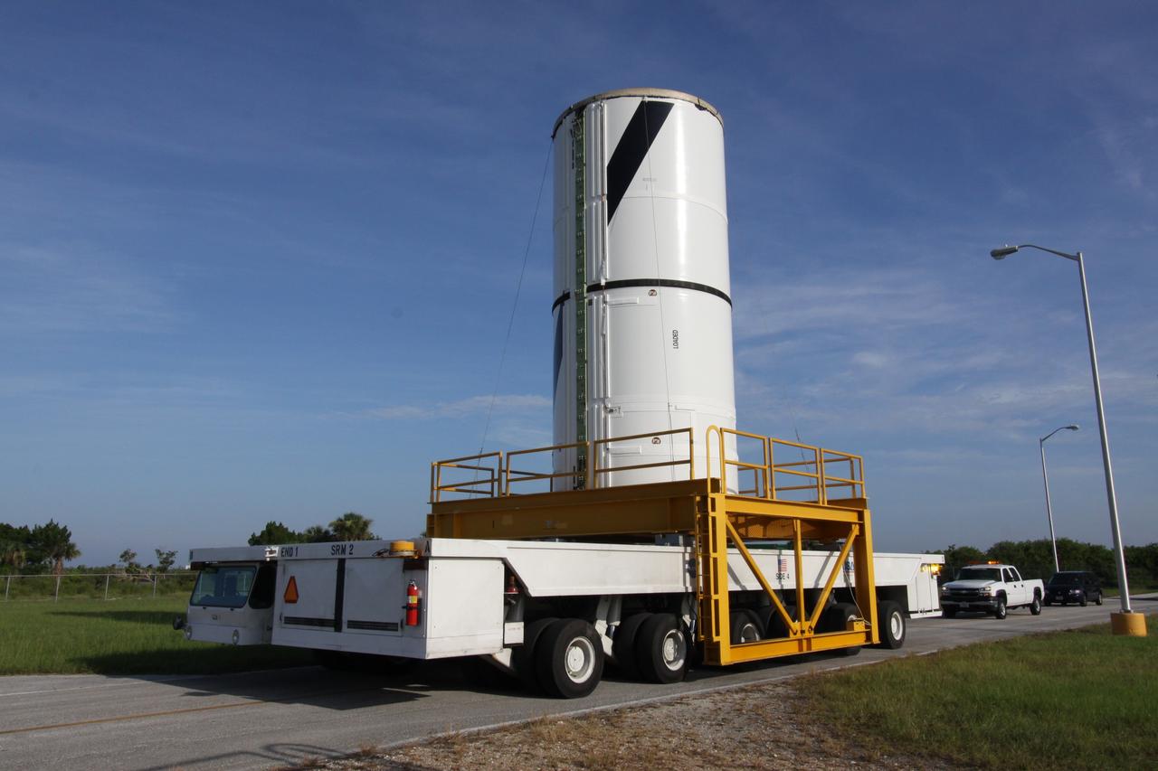 CAPE CANAVERAL, Fla. – At NASA's Kennedy Space Center in Florida, the Ares I-X forward center segment is moving from the Rotation, Processing and Surge Facility to the Vehicle Assembly Building, or VAB. The launch vehicle is being assembled in the VAB's High Bay 3. Part of the Constellation Program, the Ares I-X is the test vehicle for the Ares I, which is the essential core of a space transportation system that eventually will carry crewed missions back to the moon, on to Mars and out into the solar system . The Ares I-X flight test is targeted for no earlier than Aug. 30. Photo credit: NASA/Jack Pfaller