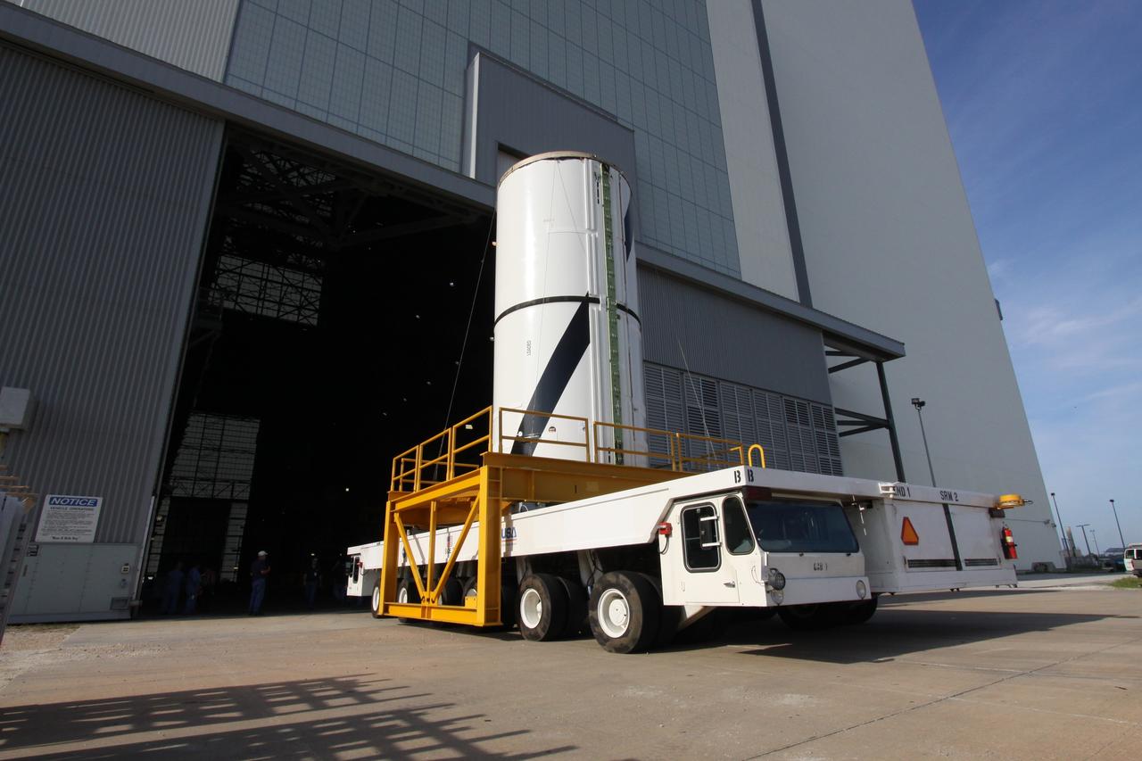 CAPE CANAVERAL, Fla. – At NASA's Kennedy Space Center in Florida, the Ares I-X forward center segment heads through the door of the Vehicle Assembly Building, or VAB. The launch vehicle is being assembled in the VAB's High Bay 3. Part of the Constellation Program, the Ares I-X is the test vehicle for the Ares I, which is the essential core of a space transportation system that eventually will carry crewed missions back to the moon, on to Mars and out into the solar system . The Ares I-X flight test is targeted for no earlier than Aug. 30. Photo credit: NASA/Jack Pfaller