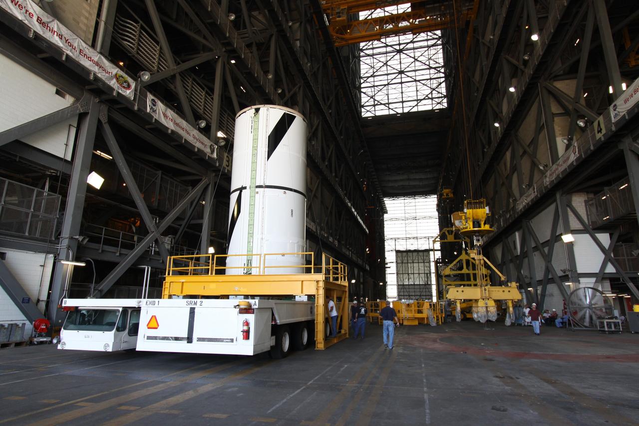 CAPE CANAVERAL, Fla. – At NASA's Kennedy Space Center in Florida, the Ares I-X forward center segment arrives in the transfer aisle of the Vehicle Assembly Building, or VAB. The launch vehicle is being assembled in the VAB's High Bay 3. Part of the Constellation Program, the Ares I-X is the test vehicle for the Ares I, which is the essential core of a space transportation system that eventually will carry crewed missions back to the moon, on to Mars and out into the solar system . The Ares I-X flight test is targeted for no earlier than Aug. 30. Photo credit: NASA/Jack Pfaller