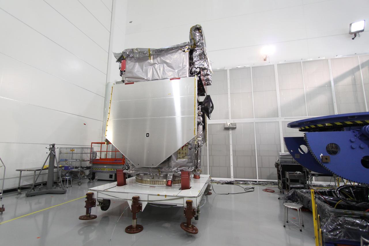 CAPE CANAVERAL, Fla. – The Solar Dynamics Observatory sits on a stand at Astrotech Space Operations in Titusville, Fla. Engineers will lower the high-gain antenna to access the battery compartment for installation of the flight battery. SDO is the first space weather research network mission in NASA's Living With a Star Program. The spacecraft's long-term measurements will give solar scientists in-depth information about changes in the sun's magnetic field and insight into how they affect Earth. In preparation for its anticipated November launch, engineers will perform a battery of comprehensive tests to ensure SDO can withstand the stresses and vibrations of the launch itself, as well as what it will encounter in the space environment after launch. Photo credit: NASA/Jack Pfaller