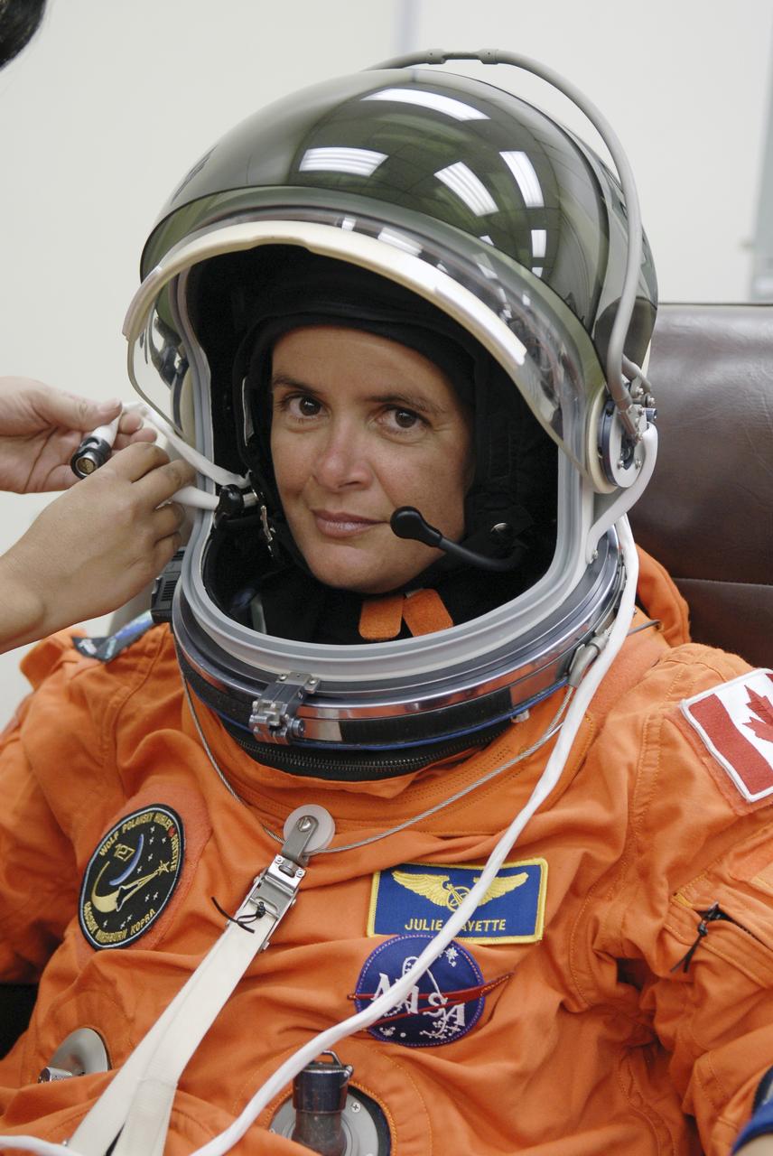 CAPE CANAVERAL, Fla. – In the Operations and Checkout Building at NASA's Kennedy Space Center in Florida, STS-127 Mission Specialist Julie Payette of the Canadian Space Agency has the communication apparatus in her helmet before heading to Launch Pad 39A for launch. Liftoff of space shuttle Endeavour is scheduled for 6:03 p.m. EDT. Today will be the sixth launch attempt for the STS-127 mission. The launch was scrubbed on June 13 and June 17 when a hydrogen gas leak occurred during tanking due to a misaligned Ground Umbilical Carrier Plate. The mission was postponed July 11, 12 and 13 due to weather conditions near the Shuttle Landing Facility at Kennedy that violated rules for launching, and lightning issues. Endeavour will deliver the Japanese Experiment Module's Exposed Facility and the Experiment Logistics Module-Exposed Section in the final of three flights dedicated to the assembly of the Japan Aerospace Exploration Agency's Kibo laboratory complex on the International Space Station. Photo credit: NASA/ Kim Shiflett