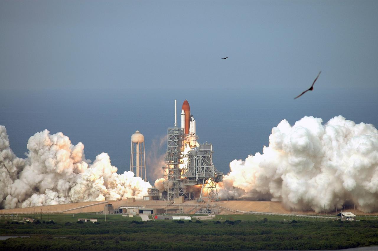 CAPE CANAVERAL, Fla. – Birds scatter as space shuttle Endeavour roars off Launch Pad 39A at NASA's Kennedy Space Center in Florida on the STS-127 mission to the International Space Station.  Liftoff was on-time at 6:03 p.m. EDT.  Today was the sixth launch attempt for the STS-127 mission.  The launch was scrubbed on June 13 and June 17 when a hydrogen gas leak occurred during tanking due to a misaligned Ground Umbilical Carrier Plate.  The mission was postponed July 11, 12 and 13 due to weather conditions near the Shuttle Landing Facility at Kennedy that violated rules for launching, and lightning issues. Endeavour will deliver the Japanese Experiment Module's Exposed Facility and the Experiment Logistics Module-Exposed Section in the final of three flights dedicated to the assembly of the Japan Aerospace Exploration Agency's Kibo laboratory complex on the International Space Station.   Photo credit: NASA/Jeffrey Marino