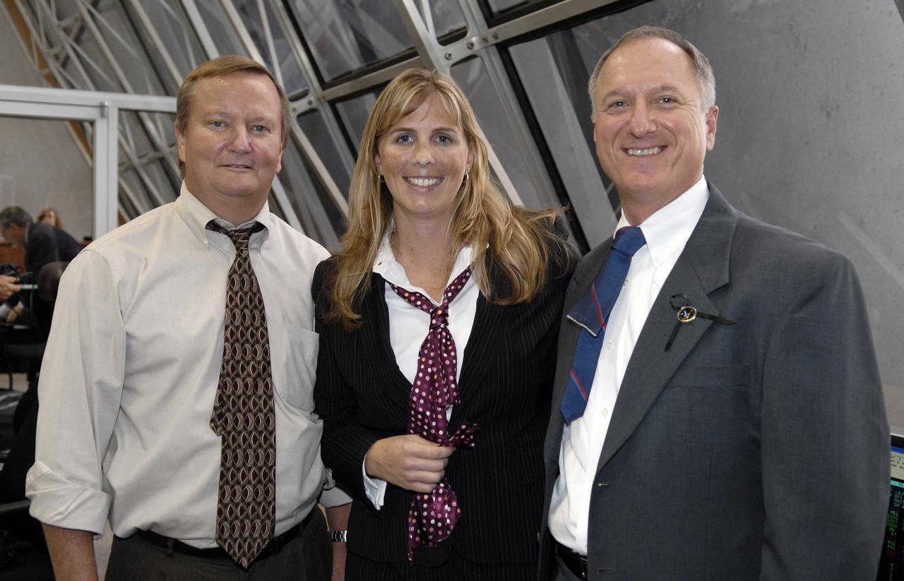 CAPE CANAVERAL, Fla. – In the Firing Room at NASA's Kennedy Space Center in Florida, Shuttle Launch Director Mike Leinbach, Endeavour Flow Director Dana Hutcherson and STS-127 Shuttle Launch Director Pete Nickolenko bask in the successful launch of space shuttle Endeavour on the STS-127 mission. Liftoff was on-time at 6:03 p.m. EDT. Today was the sixth launch attempt for the STS-127 mission. The launch was scrubbed on June 13 and June 17 when a hydrogen gas leak occurred during tanking due to a misaligned Ground Umbilical Carrier Plate. The mission was postponed July 11, 12 and 13 due to weather conditions near the Shuttle Landing Facility at Kennedy that violated rules for launching, and lightning issues. Endeavour will deliver the Japanese Experiment Module's Exposed Facility and the Experiment Logistics Module-Exposed Section in the final of three flights dedicated to the assembly of the Japan Aerospace Exploration Agency's Kibo laboratory complex on the International Space Station. Photo credit: NASA/Kim Shiflett