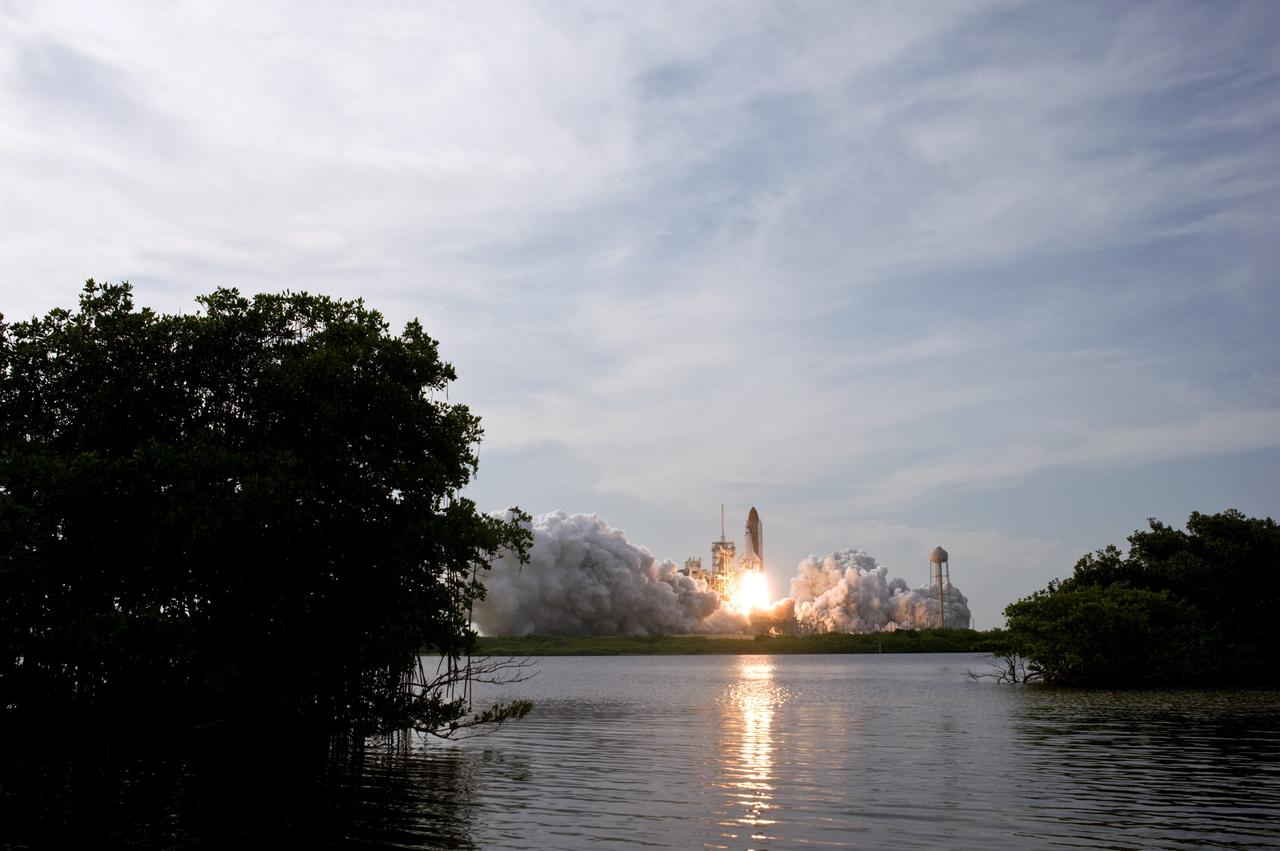 CAPE CANAVERAL, Fla. – Space shuttle Endeavour rises majestically on the STS-127 mission from amid the smoke and steam on Launch Pad 39A at NASA's Kennedy Space Center in Florida.  Liftoff was on-time at 6:03 p.m. EDT.  Today was the sixth launch attempt for the STS-127 mission.  The launch was scrubbed on June 13 and June 17 when a hydrogen gas leak occurred during tanking due to a misaligned Ground Umbilical Carrier Plate.  The mission was postponed July 11, 12 and 13 due to weather conditions near the Shuttle Landing Facility at Kennedy that violated rules for launching, and lightning issues. Endeavour will deliver the Japanese Experiment Module's Exposed Facility and the Experiment Logistics Module-Exposed Section in the final of three flights dedicated to the assembly of the Japan Aerospace Exploration Agency's Kibo laboratory complex on the International Space Station.   Photo credit: NASA/Sandra Joseph, Kevin O'Connell