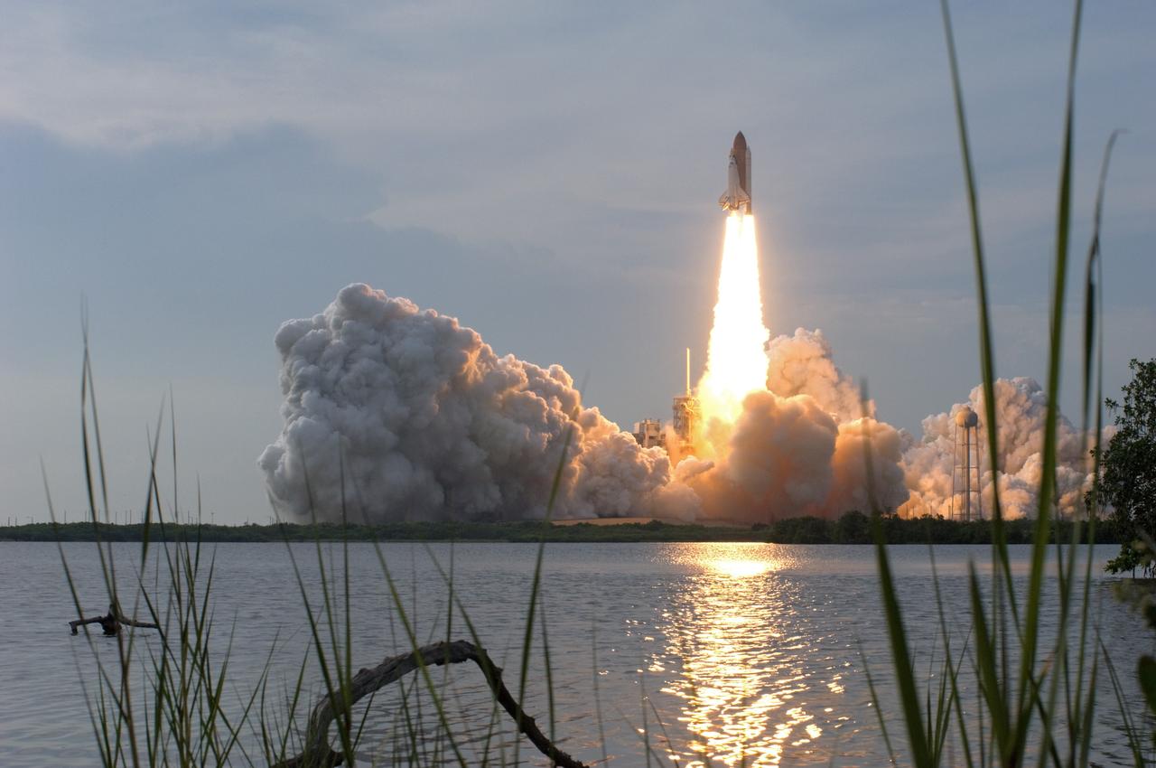 CAPE CANAVERAL, Fla. – Atop a column of fire, space shuttle Endeavour races into the cloud-washed sky from NASA Kennedy Space Center's  Launch Pad 39A on the STS-127 mission.  Liftoff was on-time at 6:03 p.m. EDT. Today was the sixth launch attempt for the STS-127 mission.  The launch was scrubbed on June 13 and June 17 when a hydrogen gas leak occurred during tanking due to a misaligned Ground Umbilical Carrier Plate.  The mission was postponed July 11, 12 and 13 due to weather conditions near the Shuttle Landing Facility at Kennedy that violated rules for launching, and lightning issues. Endeavour will deliver the Japanese Experiment Module's Exposed Facility and the Experiment Logistics Module-Exposed Section in the final of three flights dedicated to the assembly of the Japan Aerospace Exploration Agency's Kibo laboratory complex on the International Space Station.   Photo credit: NASA/Sandra Joseph, Kevin O'Connell