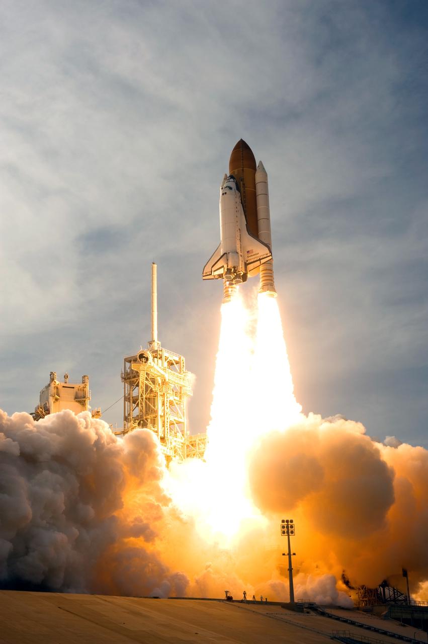 CAPE CANAVERAL, Fla. – Riding twin columns of fire, space shuttle Endeavour races toward the sky on the STS-127 mission as clouds of smoke and steam fill Launch Pad 39A at NASA's Kennedy Space Center in Florida.  Liftoff was on-time at 6:03 p.m. EDT. Today was the sixth launch attempt for the STS-127 mission.  The launch was scrubbed on June 13 and June 17 when a hydrogen gas leak occurred during tanking due to a misaligned Ground Umbilical Carrier Plate.  The mission was postponed July 11, 12 and 13 due to weather conditions near the Shuttle Landing Facility at Kennedy that violated rules for launching, and lightning issues. Endeavour will deliver the Japanese Experiment Module's Exposed Facility and the Experiment Logistics Module-Exposed Section in the final of three flights dedicated to the assembly of the Japan Aerospace Exploration Agency's Kibo laboratory complex on the International Space Station.   Photo credit: NASA/Sandra Joseph, Kevin O'Connell