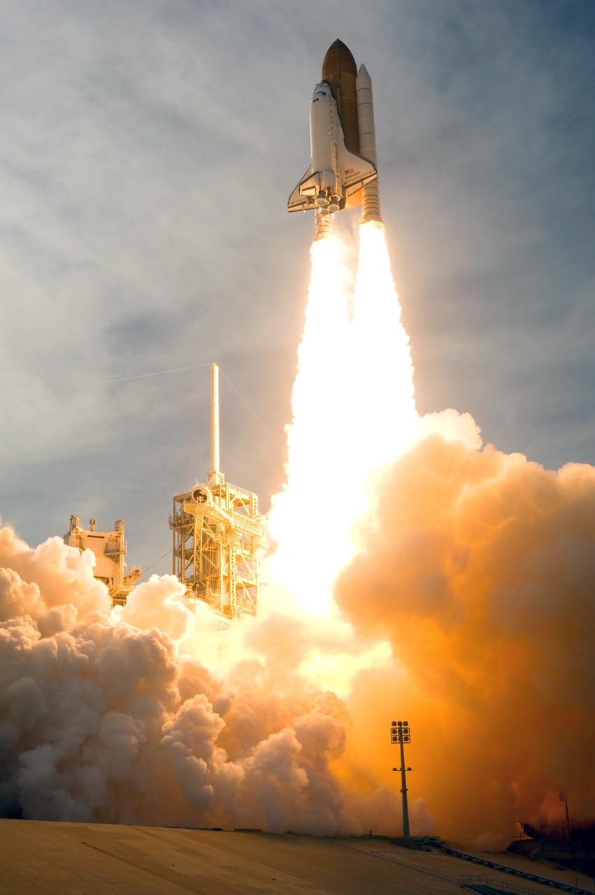 CAPE CANAVERAL, Fla. – Clouds of smoke and steam fill Launch Pad 39A at NASA's Kennedy Space Center in Florida as space shuttle Endeavour races toward the sky on columns of fire on the STS-127 mission.  Liftoff was on-time at 6:03 p.m. EDT. Today was the sixth launch attempt for the STS-127 mission.  The launch was scrubbed on June 13 and June 17 when a hydrogen gas leak occurred during tanking due to a misaligned Ground Umbilical Carrier Plate.  The mission was postponed July 11, 12 and 13 due to weather conditions near the Shuttle Landing Facility at Kennedy that violated rules for launching, and lightning issues. Endeavour will deliver the Japanese Experiment Module's Exposed Facility and the Experiment Logistics Module-Exposed Section in the final of three flights dedicated to the assembly of the Japan Aerospace Exploration Agency's Kibo laboratory complex on the International Space Station.   Photo credit: NASA/Sandra Joseph, Kevin O'Connell