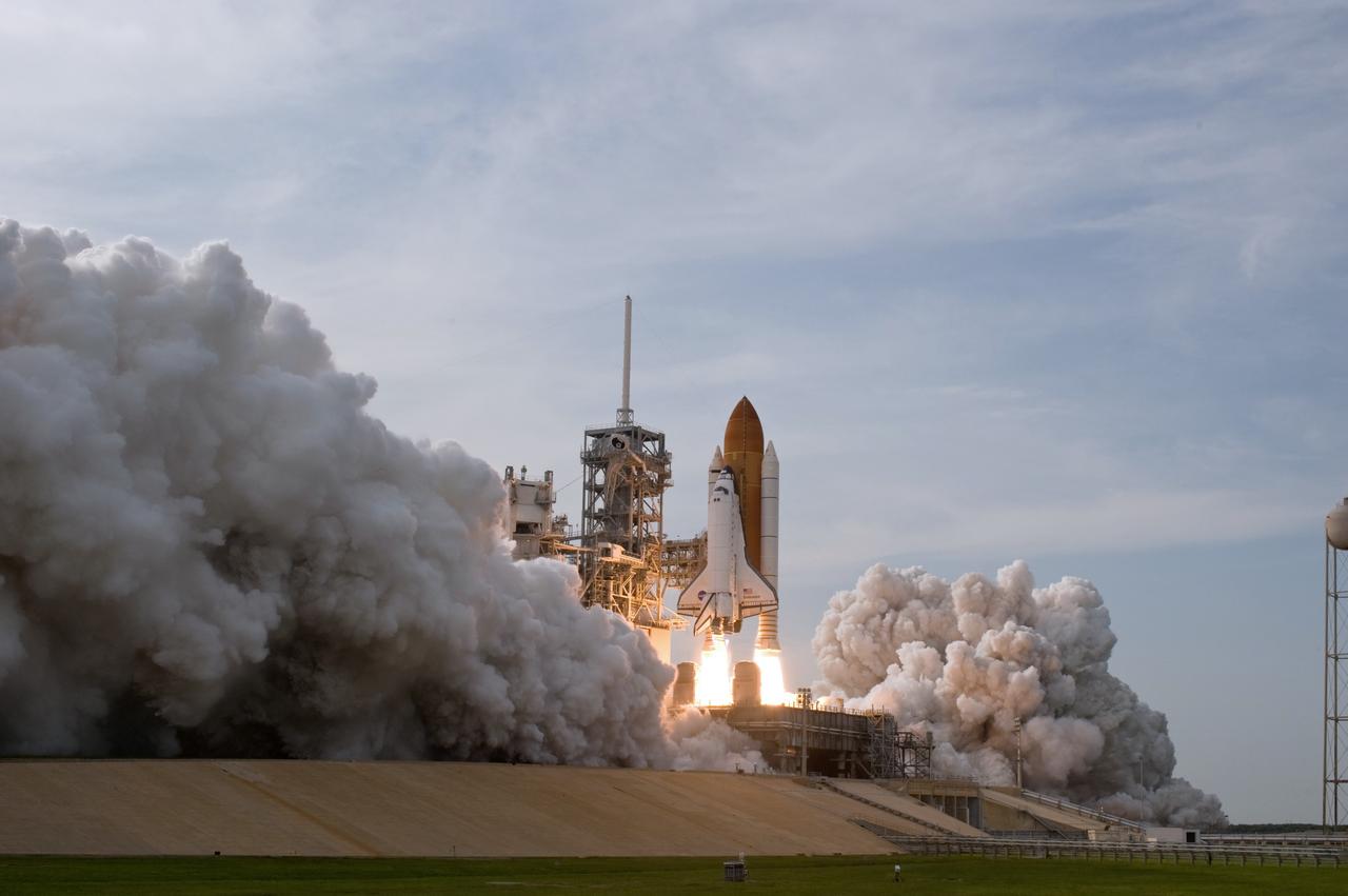 CAPE CANAVERAL, Fla. – Clouds of smoke and steam roll across Launch Pad 39A at NASA's Kennedy Space Center in Florida as space shuttle Endeavour races toward the sky on columns of fire on the STS-127 mission. Liftoff was on-time at 6:03 p.m. EDT. Today was the sixth launch attempt for the STS-127 mission.  The launch was scrubbed on June 13 and June 17 when a hydrogen gas leak occurred during tanking due to a misaligned Ground Umbilical Carrier Plate.  The mission was postponed July 11, 12 and 13 due to weather conditions near the Shuttle Landing Facility at Kennedy that violated rules for launching, and lightning issues. Endeavour will deliver the Japanese Experiment Module's Exposed Facility and the Experiment Logistics Module-Exposed Section in the final of three flights dedicated to the assembly of the Japan Aerospace Exploration Agency's Kibo laboratory complex on the International Space Station.   Photo credit: NASA/Sandra Joseph, Kevin O'Connell