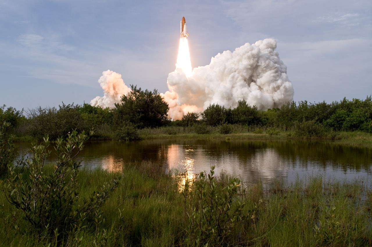 CAPE CANAVERAL, Fla. – Space shuttle Endeavour  leaps from the cloud of smoke and steam on NASA Kennedy Space Center's Launch Pad 39A as it roars into space on the STS-127 mission. Liftoff was on-time at 6:03 p.m. EDT. Today was the sixth launch attempt for the STS-127 mission.  The launch was scrubbed on June 13 and June 17 when a hydrogen gas leak occurred during tanking due to a misaligned Ground Umbilical Carrier Plate.  The mission was postponed July 11, 12 and 13 due to weather conditions near the Shuttle Landing Facility at Kennedy that violated rules for launching, and lightning issues. Endeavour will deliver the Japanese Experiment Module's Exposed Facility and the Experiment Logistics Module-Exposed Section in the final of three flights dedicated to the assembly of the Japan Aerospace Exploration Agency's Kibo laboratory complex on the International Space Station.   Photo credit: NASA/Tony Gray, Tom Farrar