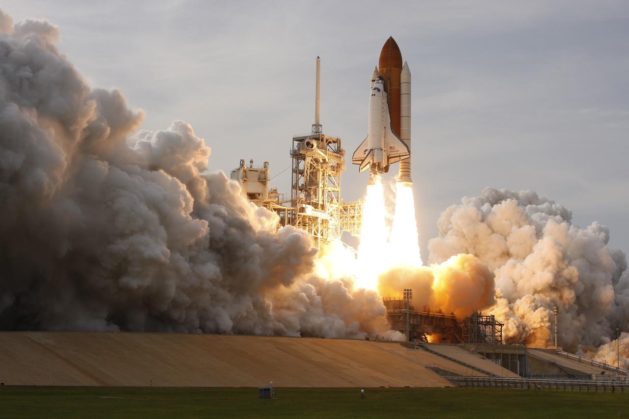CAPE CANAVERAL, Fla. – Columns of fire propel space shuttle Endeavour off NASA Kennedy Space Center's Launch Pad 39A creating rolling clouds of smoke and steam.  Liftoff of Endeavour on the STS-127 mission was on-time at 6:03 p.m. EDT.  This was the sixth launch attempt for the STS-127 mission.  The launch was scrubbed on June 13 and June 17 when a hydrogen gas leak occurred during tanking due to a misaligned Ground Umbilical Carrier Plate.  The mission was postponed July 11, 12 and 13 due to weather conditions near the Shuttle Landing Facility at Kennedy that violated rules for launching, and lightning issues. Endeavour will deliver the Japanese Experiment Module's Exposed Facility and the Experiment Logistics Module-Exposed Section in the final of three flights dedicated to the assembly of the Japan Aerospace Exploration Agency's Kibo laboratory complex on the International Space Station.   Photo courtesy of Scott Andrews