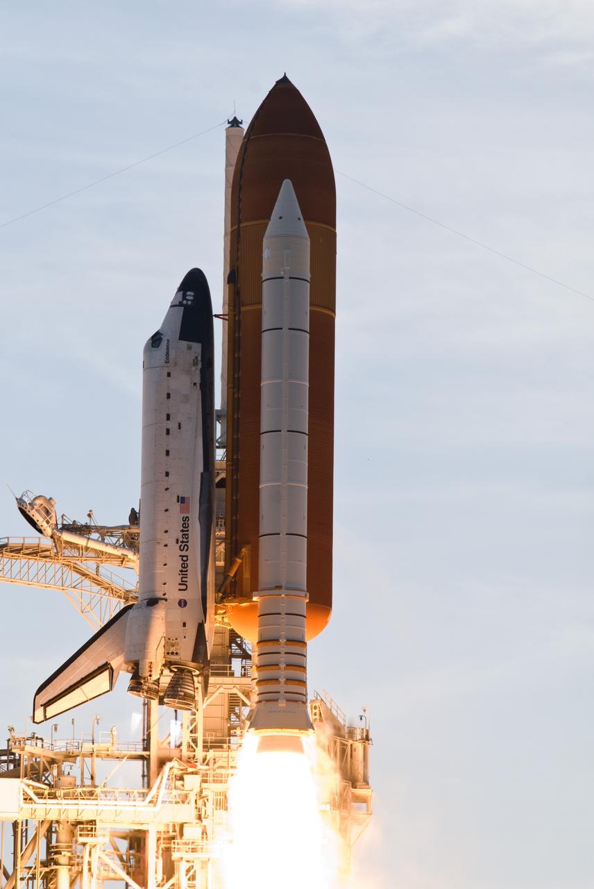 CAPE CANAVERAL, Fla. – Space shuttle Endeavour begins its climb into space from NASA Kennedy Space Center's Launch Pad 39A on the STS-127 mission. Liftoff was on-time at 6:03 p.m. EDT. This was the sixth launch attempt for the STS-127 mission.  The launch was scrubbed on June 13 and June 17 when a hydrogen gas leak occurred during tanking due to a misaligned Ground Umbilical Carrier Plate.  The mission was postponed July 11, 12 and 13 due to weather conditions near the Shuttle Landing Facility at Kennedy that violated rules for launching, and lightning issues. Endeavour will deliver the Japanese Experiment Module's Exposed Facility and the Experiment Logistics Module-Exposed Section in the final of three flights dedicated to the assembly of the Japan Aerospace Exploration Agency's Kibo laboratory complex on the International Space Station.   Photo credit: NASA/Mike Gayle, Rusty Backer