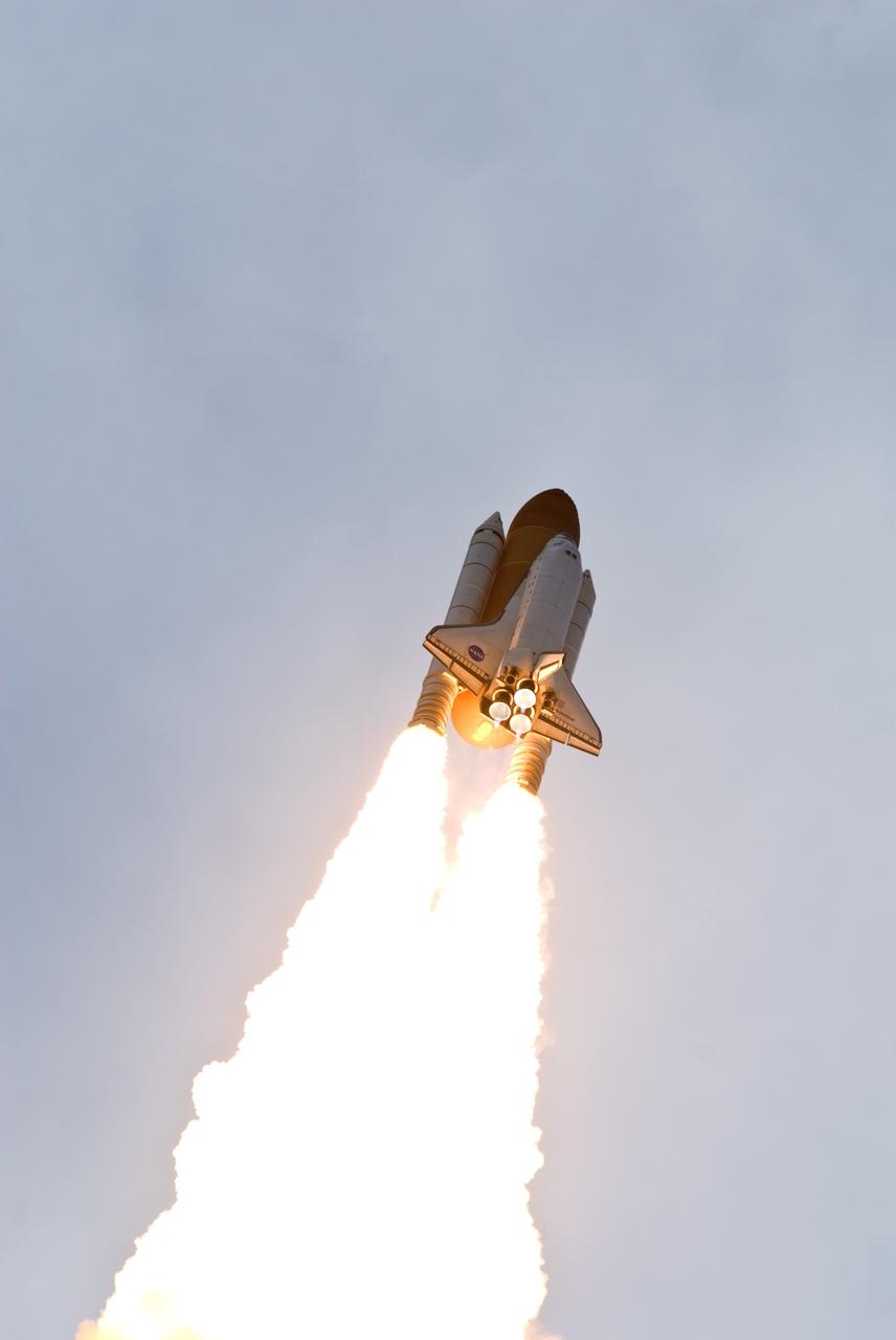 CAPE CANAVERAL, Fla. – The fiery columns from the solid rocket boosters help hurtle space shuttle Endeavour into space on the STS-127 mission.  Liftoff from NASA Kennedy Space Center's Launch Pad 39A was on-time at 6:03 p.m. EDT.  This was the sixth launch attempt for the STS-127 mission.  The launch was scrubbed on June 13 and June 17 when a hydrogen gas leak occurred during tanking due to a misaligned Ground Umbilical Carrier Plate.  The mission was postponed July 11, 12 and 13 due to weather conditions near the Shuttle Landing Facility at Kennedy that violated rules for launching, and lightning issues. Endeavour will deliver the Japanese Experiment Module's Exposed Facility and the Experiment Logistics Module-Exposed Section in the final of three flights dedicated to the assembly of the Japan Aerospace Exploration Agency's Kibo laboratory complex on the International Space Station.   Photo credit: NASA/Mike Gayle, Rusty Backer