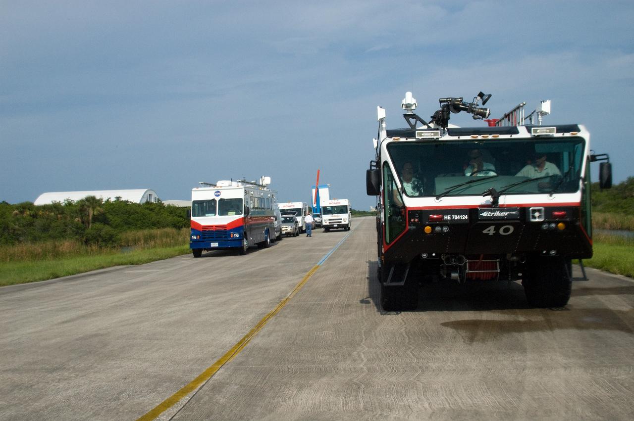CAPE CANAVERAL, Fla. – The convoy command and SCAPE vehicles are in position at the Shuttle Landing Facility at NASA's Kennedy Space Center in Florida in the event a return-to-landing-site is needed after launch of space shuttle Endeavour on the STS-127 mission.  Liftoff was on-time at 6:03 p.m. EDT. This was the sixth launch attempt for the STS-127 mission.  The launch was scrubbed on June 13 and June 17 when a hydrogen gas leak occurred during tanking due to a misaligned Ground Umbilical Carrier Plate.  The mission was postponed July 11, 12 and 13 due to weather conditions near the Shuttle Landing Facility at Kennedy that violated rules for launching, and lightning issues. Endeavour will deliver the Japanese Experiment Module's Exposed Facility and the Experiment Logistics Module-Exposed Section in the final of three flights dedicated to the assembly of the Japan Aerospace Exploration Agency's Kibo laboratory complex on the International Space Station.   Photo credit: NASA/Chuck Tintera