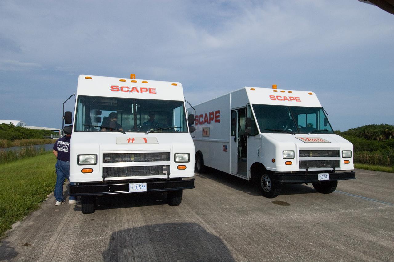 CAPE CANAVERAL, Fla. – SCAPE vehicles are in position at the Shuttle Landing Facility at NASA's Kennedy Space Center in Florida in the event a return-to-landing-site is needed after launch of space shuttle Endeavour on the STS-127 mission.  Liftoff was on-time at 6:03 p.m. EDT.  This was the sixth launch attempt for the STS-127 mission.  The launch was scrubbed on June 13 and June 17 when a hydrogen gas leak occurred during tanking due to a misaligned Ground Umbilical Carrier Plate.  The mission was postponed July 11, 12 and 13 due to weather conditions near the Shuttle Landing Facility at Kennedy that violated rules for launching, and lightning issues. Endeavour will deliver the Japanese Experiment Module's Exposed Facility and the Experiment Logistics Module-Exposed Section in the final of three flights dedicated to the assembly of the Japan Aerospace Exploration Agency's Kibo laboratory complex on the International Space Station.   Photo credit: NASA/Chuck Tintera