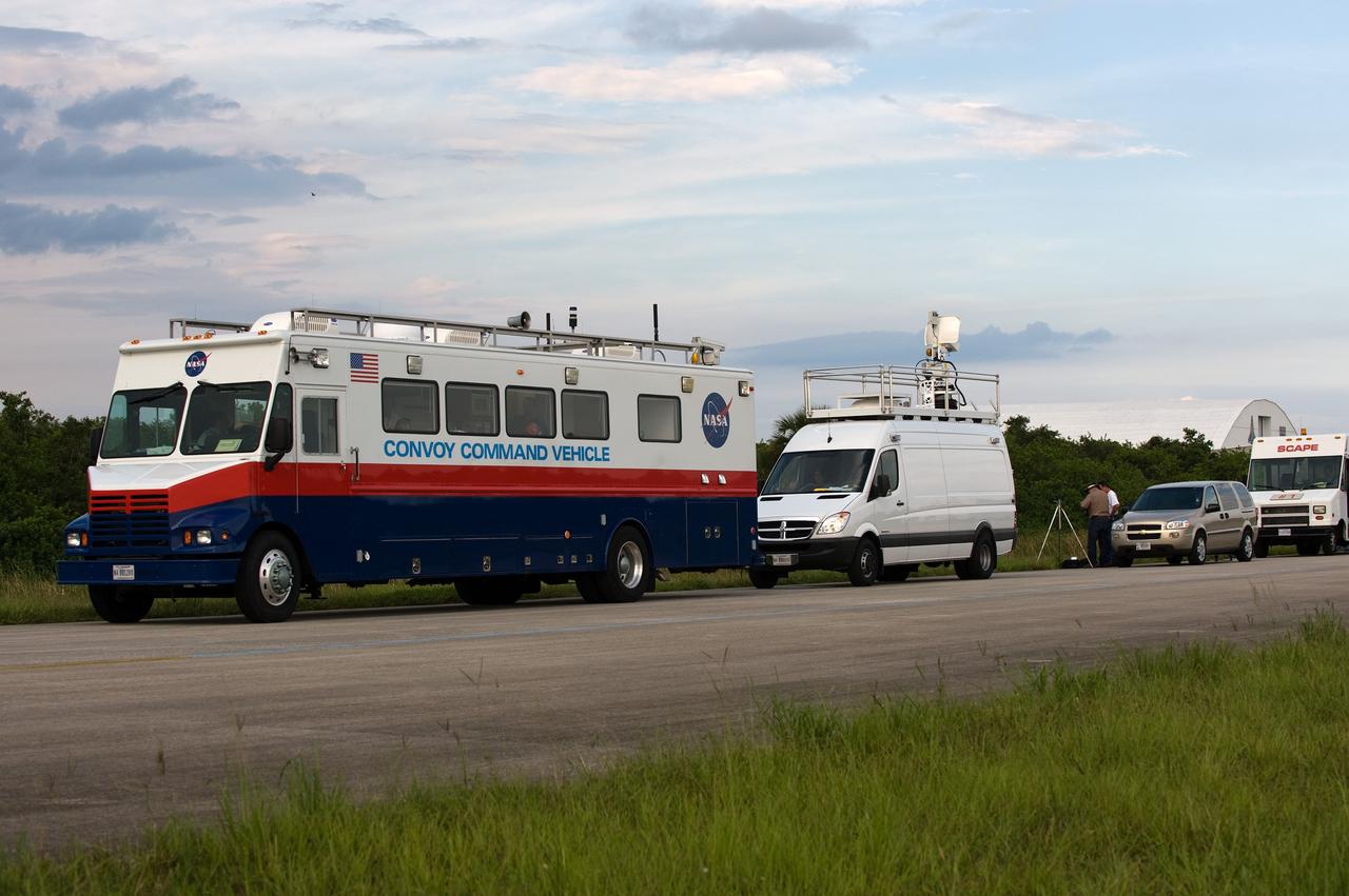CAPE CANAVERAL, Fla. – The convoy command and SCAPE vehicles are in position at the Shuttle Landing Facility at NASA's Kennedy Space Center in Florida in the event a return-to-landing-site is needed after launch of space shuttle Endeavour on the STS-127 mission.  Liftoff was on-time at 6:03 p.m. EDT. This was the sixth launch attempt for the STS-127 mission.  The launch was scrubbed on June 13 and June 17 when a hydrogen gas leak occurred during tanking due to a misaligned Ground Umbilical Carrier Plate.  The mission was postponed July 11, 12 and 13 due to weather conditions near the Shuttle Landing Facility at Kennedy that violated rules for launching, and lightning issues. Endeavour will deliver the Japanese Experiment Module's Exposed Facility and the Experiment Logistics Module-Exposed Section in the final of three flights dedicated to the assembly of the Japan Aerospace Exploration Agency's Kibo laboratory complex on the International Space Station.   Photo credit: NASA/Carl Winebarger