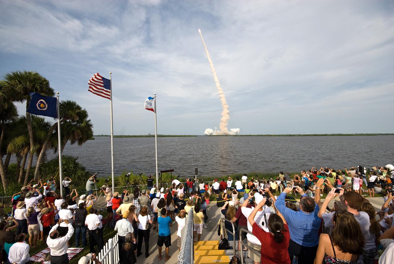CAPE CANAVERAL, Fla. – Crowds fill NASA Kennedy Space Center's Banana River viewing site to see and record  space shuttle Endeavour as it roars into space on the STS-127 mission. Liftoff was on-time at 6:03 p.m. EDT.   This was the sixth launch attempt for the STS-127 mission.  The launch was scrubbed on June 13 and June 17 when a hydrogen gas leak occurred during tanking due to a misaligned Ground Umbilical Carrier Plate.  The mission was postponed July 11, 12 and 13 due to weather conditions near the Shuttle Landing Facility at Kennedy that violated rules for launching, and lightning issues. Endeavour will deliver the Japanese Experiment Module's Exposed Facility and the Experiment Logistics Module-Exposed Section in the final of three flights dedicated to the assembly of the Japan Aerospace Exploration Agency's Kibo laboratory complex on the International Space Station.   Photo credit: NASA/Ben Cooper