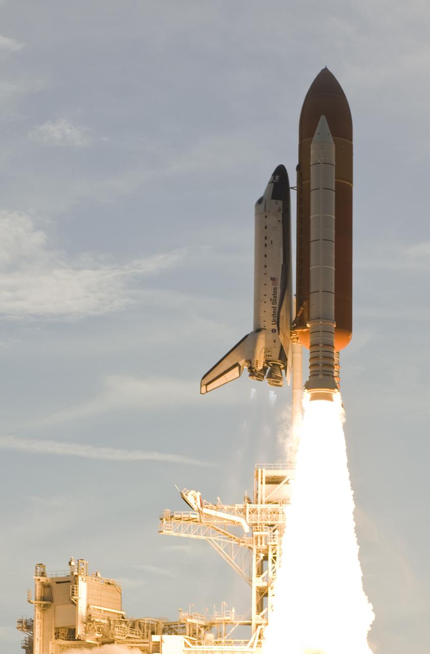 CAPE CANAVERAL, Fla. –  Space shuttle Endeavour leaps from orange-tinted smoke filling NASA Kennedy Space Center's Launch Pad 39A on the STS-127 mission.  Liftoff was on-time at 6:03 p.m. EDT.  This was the sixth launch attempt for the STS-127 mission.  The launch was scrubbed on June 13 and June 17 when a hydrogen gas leak occurred during tanking due to a misaligned Ground Umbilical Carrier Plate.  The mission was postponed July 11, 12 and 13 due to weather conditions near the Shuttle Landing Facility at Kennedy that violated rules for launching, and lightning issues. Endeavour will deliver the Japanese Experiment Module's Exposed Facility and the Experiment Logistics Module-Exposed Section in the final of three flights dedicated to the assembly of the Japan Aerospace Exploration Agency's Kibo laboratory complex on the International Space Station.   Photo courtesy of Scott Andrews