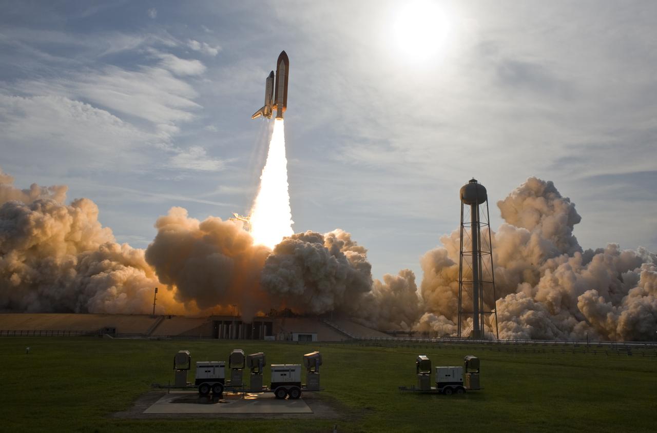 CAPE CANAVERAL, Fla. –  Glowing clouds roll across NASA Kennedy Space Center's Launch Pad 39A as space shuttle Endeavour majestically roars into the sky on the STS-127 mission. Liftoff was on-time at 6:03 p.m. EDT.  This was the sixth launch attempt for the STS-127 mission.  The launch was scrubbed on June 13 and June 17 when a hydrogen gas leak occurred during tanking due to a misaligned Ground Umbilical Carrier Plate.  The mission was postponed July 11, 12 and 13 due to weather conditions near the Shuttle Landing Facility at Kennedy that violated rules for launching, and lightning issues. Endeavour will deliver the Japanese Experiment Module's Exposed Facility and the Experiment Logistics Module-Exposed Section in the final of three flights dedicated to the assembly of the Japan Aerospace Exploration Agency's Kibo laboratory complex on the International Space Station.   Photo courtesy of Scott Andrews