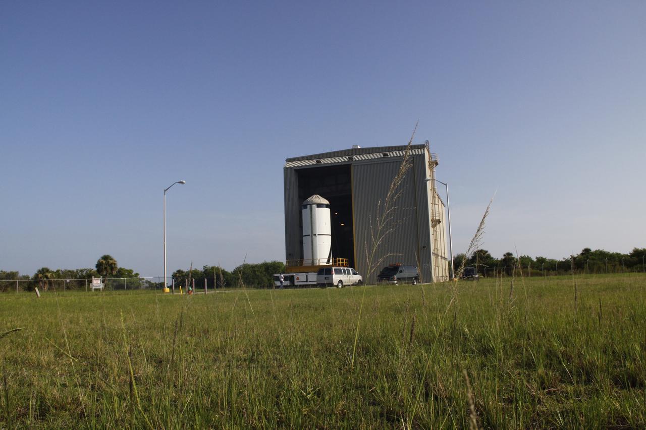 CAPE CANAVERAL, Fla. – The Ares I-X forward segment leaves the Rotation, Surge and Processing Facility at NASA's Kennedy Space Center in Florida. It is being transported to the Vehicle Assembly Building for mating with the aft center and aft segments already stacked.Part of the Constellation Program, the Ares I-X is the test vehicle for the Ares I, which is the essential core of a space transportation system that eventually will carry crewed missions back to the moon, on to Mars and out into the solar system . The Ares I-X flight test is targeted for no earlier than Aug. 30. Photo credit: NASA/Troy Cryder