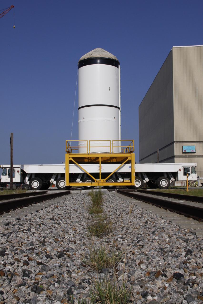 CAPE CANAVERAL, Fla. – The Ares I-X forward segment leaves the Rotation, Surge and Processing Facility at NASA's Kennedy Space Center in Florida. It is being transported to the Vehicle Assembly Building for mating with the aft center and aft segments already stacked. Part of the Constellation Program, the Ares I-X is the test vehicle for the Ares I, which is the essential core of a space transportation system that eventually will carry crewed missions back to the moon, on to Mars and out into the solar system . The Ares I-X flight test is targeted for no earlier than Aug. 30. Photo credit: NASA/Troy Cryder