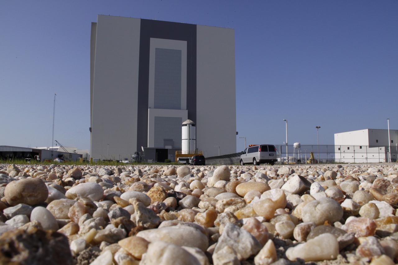 CAPE CANAVERAL, Fla. – The Ares I-X forward segment nears the Vehicle Assembly Building at NASA's Kennedy Space Center in Florida. It will be mated with the aft center and aft segments already stacked. Part of the Constellation Program, the Ares I-X is the test vehicle for the Ares I, which is the essential core of a space transportation system that eventually will carry crewed missions back to the moon, on to Mars and out into the solar system . The Ares I-X flight test is targeted for no earlier than Aug. 30. Photo credit: NASA/Troy Cryder