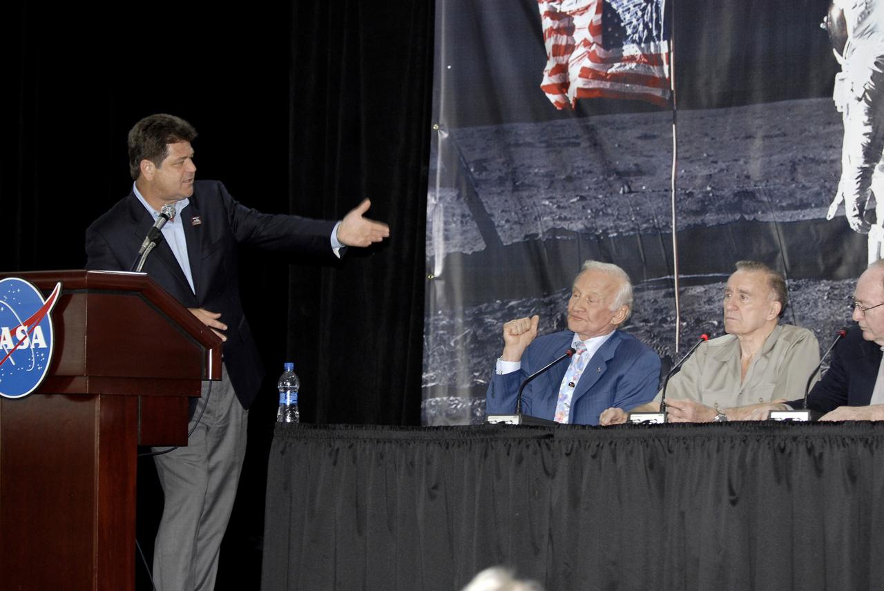 CAPE CANAVERAL, Fla. – CNN Correspondent John Zarella (left), moderates NASA's 40th Anniversary of Apollo Celebration of the moon launch and landing in July 1969, which was held in the Apollo/Saturn V Center at NASA's Kennedy Space Center in Florida. At right are Apollo astronauts Buzz Aldrin, Walt Cunningham and Edgar Mitchell. Eight Apollo astronauts shared their experiences with a crowd of guests. Photo credit: NASA/Kim Shiflett