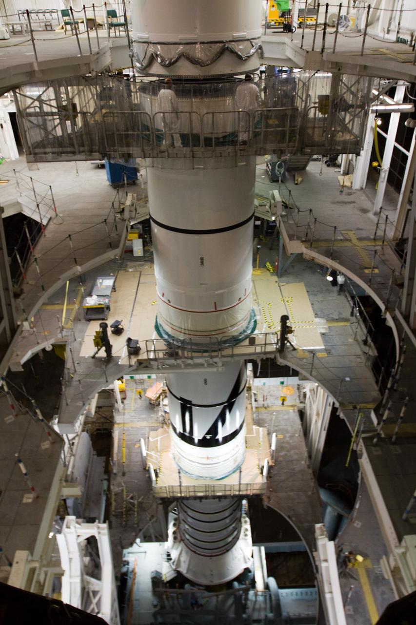 CAPE CANAVERAL, Fla. – In the High Bay 3 of NASA Kennedy Space Center's Vehicle Assembly Building, the Ares I-X forward segment is mated with the forward center segment, already stacked with the aft center and the aft skirt segments below. Part of the Constellation Program, the Ares I-X is the test vehicle for the Ares I, which is the essential core of a space transportation system that eventually will carry crewed missions back to the moon, on to Mars and out into the solar system . The Ares I-X flight test is targeted for no earlier than Aug. 30. Photo credit: NASA/Troy Cryder