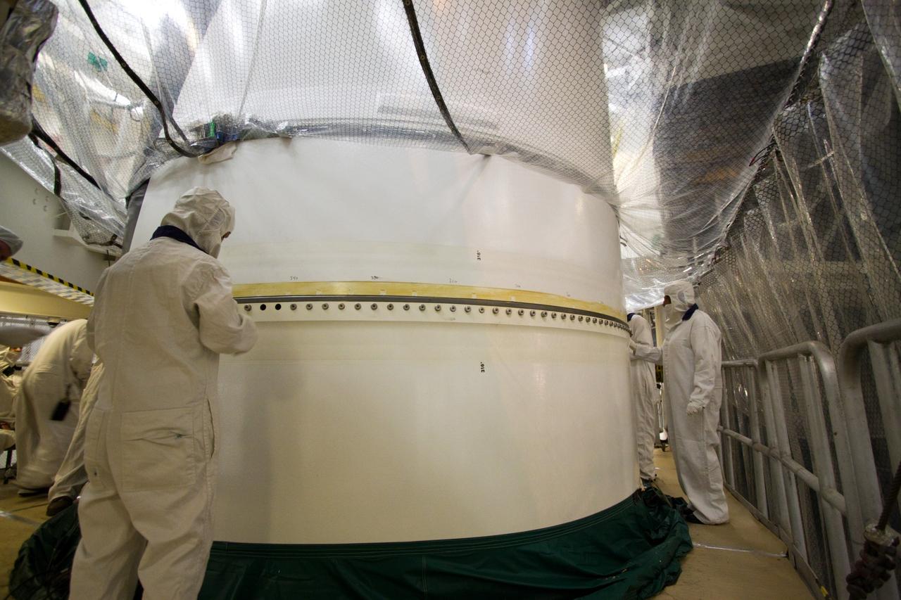CAPE CANAVERAL, Fla. – In the Vehicle Assembly Building's High Bay 3 at NASA's Kennedy Space Center in Florida, the forward segment is mated to the forward center segment atop the aft assembly (aft segment and aft skirt). Part of the Constellation Program, the Ares I-X is the test vehicle for the Ares I, which is the essential core of a space transportation system that eventually will carry crewed missions back to the moon, on to Mars and out into the solar system . The Ares I-X flight test is targeted for no earlier than Aug. 30. Photo credit: NASA/Jack Pfaller