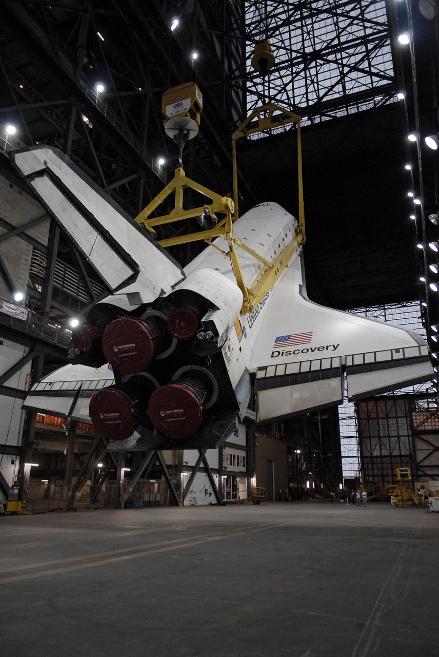 CAPE CANAVERAL, Fla. – After rollover from Orbiter Processing Facility 3 at NASA's Kennedy Space Center, Fla., to the transfer aisle of the Vehicle Assembly Building, space shuttle Discovery is being raised to vertical. It will be lifted into High Bay 1 where it will be mated to the external fuel tank and solid rocket boosters already installed on the mobile launcher platform. The shuttle is scheduled to roll out to Launch Pad 39A the first week of August to prepare for the STS-128 mission to the International Space Station. Discovery will carry the Leonardo Multi-Purpose Logistics Module containing life support racks and science racks and the Lightweight Multi-Purpose Experiment Support Structure Carrier in its payload bay. Launch of Discovery is targeted for late August. Photo credit: NASA/Kim Shiflett
