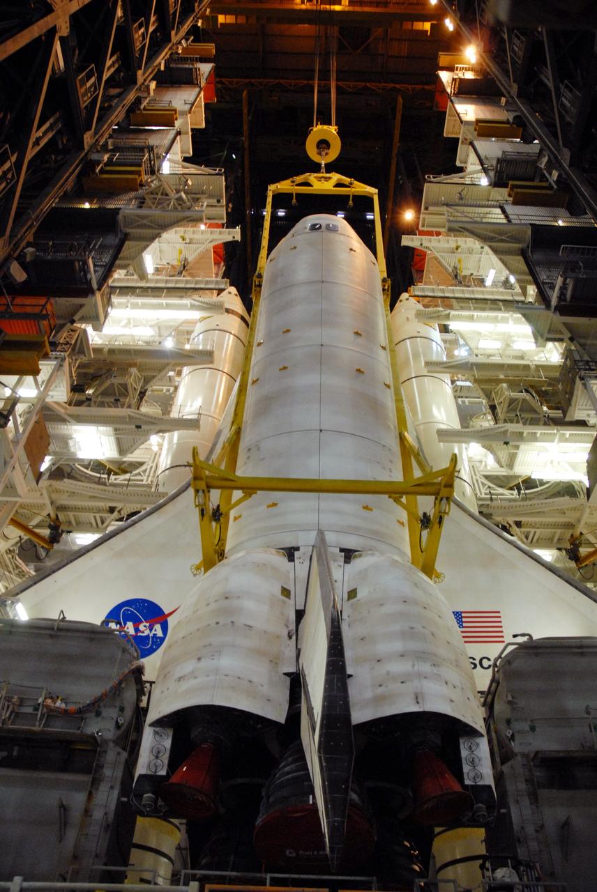 CAPE CANAVERAL, Fla. – In High Bay 1 of the Vehicle Assembly Building at NASA's Kennedy Space Center in Florida, Discovery is lowered onto the mobile launcher platform where it will be attached to the external fuel tank.  Discovery is scheduled to roll out to Launch Pad 39A the first week of August to prepare for the STS-128 mission to the International Space Station.  The shuttle will carry the Leonardo Multi-Purpose Logistics Module containing life support racks and science racks and the Lightweight Multi-Purpose Experiment Support Structure Carrier in its payload bay.  Launch of Discovery is targeted for late August.  Photo credit: NASA/Ben Smegelsky