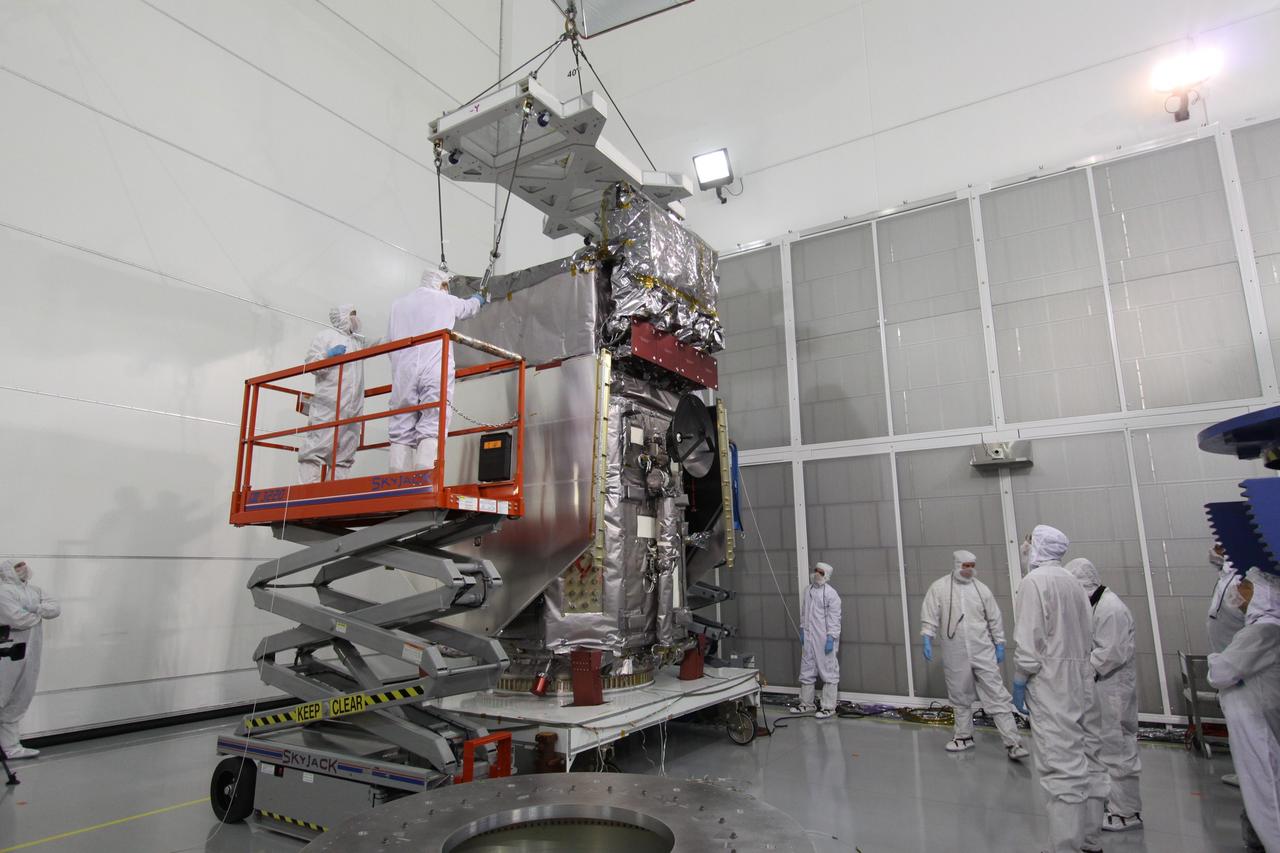 CAPE CANAVERAL, Fla. – At the Astrotech Payload Processing Facility in Titusville, Fla., the Solar Dynamics Observatory is fitted with a crane to lift it from the work stand.  The spacecraft will be moved onto a Ransome table that will allow it to be rotated in various directions for access to different areas of the spacecraft. SDO is the first space weather research network mission in NASA's Living With a Star Program.  The spacecraft's long-term measurements will give solar scientists in-depth information about changes in the sun's magnetic field and insight into how they affect Earth.  In preparation for its anticipated November launch, engineers will perform a battery of comprehensive tests to ensure SDO can withstand the stresses and vibrations of the launch itself, as well as what it will encounter in the space environment after launch.  Photo credit: NASA/Jack Pfaller