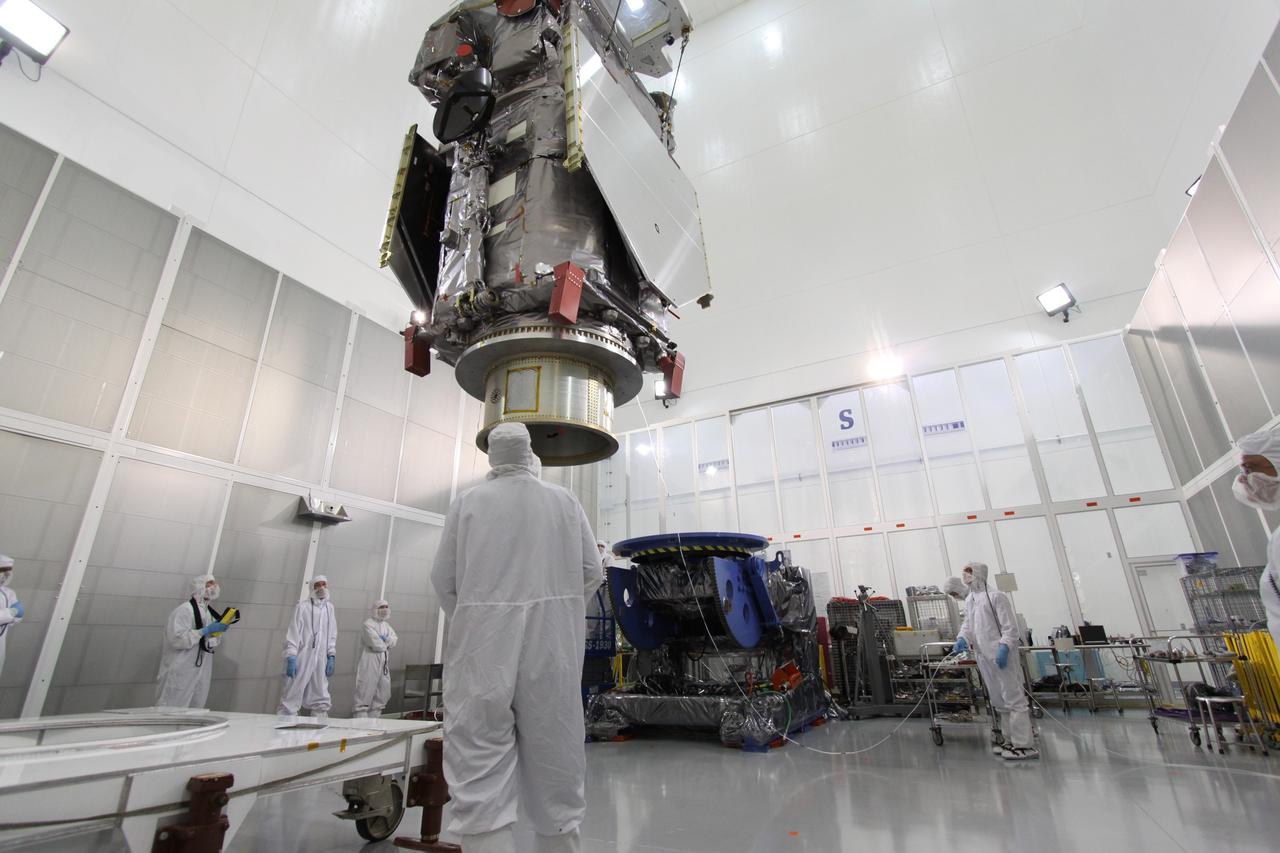 CAPE CANAVERAL, Fla. – At the Astrotech Payload Processing Facility in Titusville, Fla.,  the Solar Dynamics Observatory is  moved across the floor toward the Ransome table in the background.  The table will be used to rotate the spacecraft in various directions for access to different areas of the spacecraft. SDO is the first space weather research network mission in NASA's Living With a Star Program.  The spacecraft's long-term measurements will give solar scientists in-depth information about changes in the sun's magnetic field and insight into how they affect Earth.  In preparation for its anticipated November launch, engineers will perform a battery of comprehensive tests to ensure SDO can withstand the stresses and vibrations of the launch itself, as well as what it will encounter in the space environment after launch.  Photo credit: NASA/Jack Pfaller