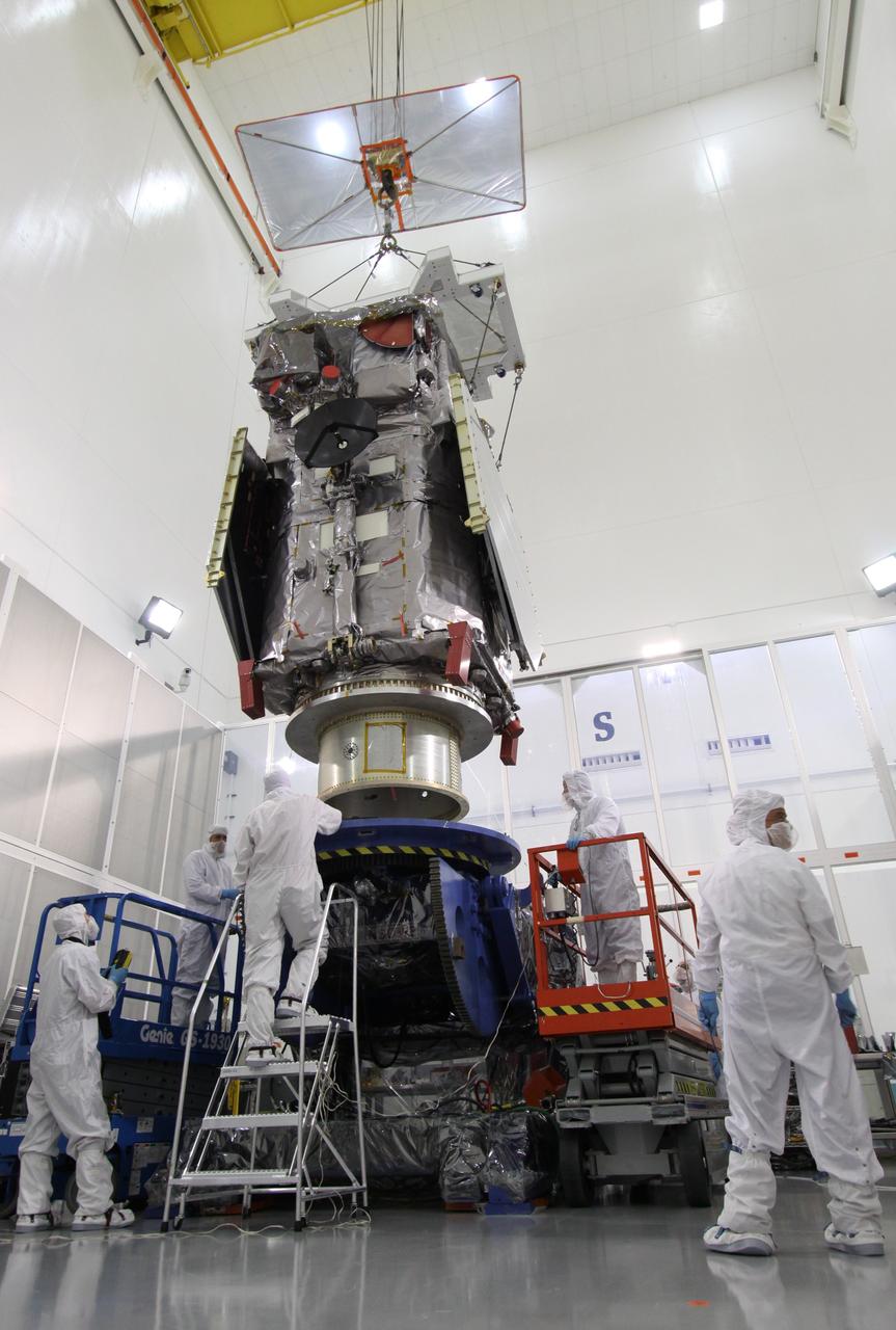 CAPE CANAVERAL, Fla. – At the Astrotech Payload Processing Facility in Titusville, Fla.,  the Solar Dynamics Observatory is  lowered onto the Ransome table.  The table will be used to rotate the spacecraft in various directions for access to different areas of the spacecraft. SDO is the first space weather research network mission in NASA's Living With a Star Program.  The spacecraft's long-term measurements will give solar scientists in-depth information about changes in the sun's magnetic field and insight into how they affect Earth.  In preparation for its anticipated November launch, engineers will perform a battery of comprehensive tests to ensure SDO can withstand the stresses and vibrations of the launch itself, as well as what it will encounter in the space environment after launch.  Photo credit: NASA/Jack Pfaller