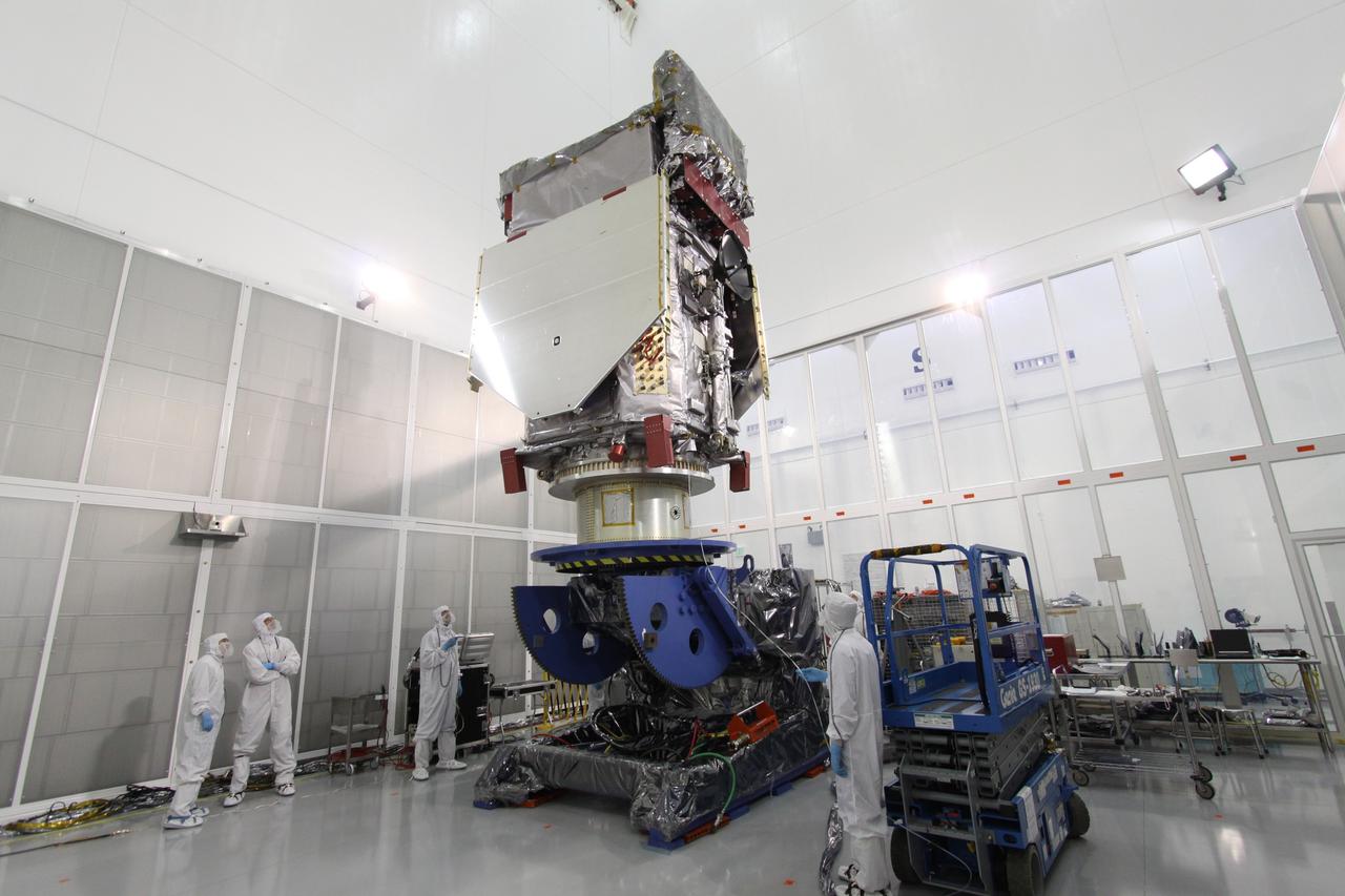 CAPE CANAVERAL, Fla. – At the Astrotech Payload Processing Facility in Titusville, Fla.,  the Solar Dynamics Observatory is  lowered onto the Ransome table.  The table will be used to rotate the spacecraft in various directions for access to different areas of the spacecraft.  SDO is the first space weather research network mission in NASA's Living With a Star Program.  The spacecraft's long-term measurements will give solar scientists in-depth information about changes in the sun's magnetic field and insight into how they affect Earth.  In preparation for its anticipated November launch, engineers will perform a battery of comprehensive tests to ensure SDO can withstand the stresses and vibrations of the launch itself, as well as what it will encounter in the space environment after launch.  Photo credit: NASA/Jack Pfaller
