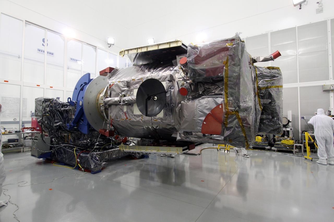 CAPE CANAVERAL, Fla. – At the Astrotech Payload Processing Facility in Titusville, Fla.,  the Solar Dynamics Observatory is  rotated on a Ransome table to a horizontal position.  The rotation will allow access to different areas of the spacecraft. SDO is the first space weather research network mission in NASA's Living With a Star Program.  The spacecraft's long-term measurements will give solar scientists in-depth information about changes in the sun's magnetic field and insight into how they affect Earth.  In preparation for its anticipated November launch, engineers will perform a battery of comprehensive tests to ensure SDO can withstand the stresses and vibrations of the launch itself, as well as what it will encounter in the space environment after launch.  Photo credit: NASA/Jack Pfaller