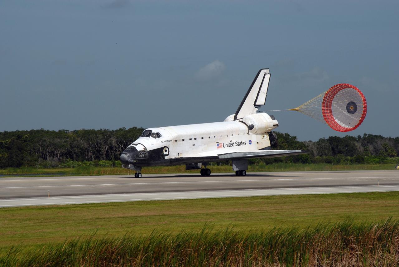 CAPE CANAVERAL, Fla. –  The drogue chute slows space shuttle Endeavour on Runway 15 at NASA's Kennedy Space Center in Florida to complete the 16-day, 6.5-million mile journey on the STS-127 mission to the International Space Station. Endeavour landed on orbit 248.  Main gear touchdown was at 10:48:08 a.m. EDT. Nose gear touchdown was at 10:48:21 a.m. and wheels stop was at 10:49:13 a.m. Endeavour delivered the Japanese Experiment Module's Exposed Facility and the Experiment Logistics Module-Exposed Section to the International Space Station. The mission was the 29th flight to the station, the 23rd flight of Endeavour and the 127th in the Space Shuttle Program, as well as the 71st landing at Kennedy.  Photo credit: NASA/Jim Grossmann