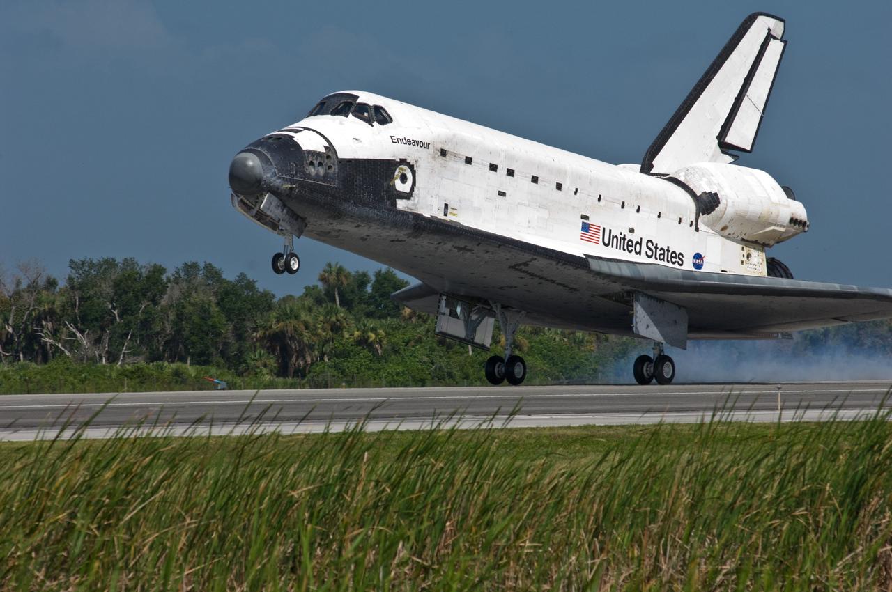 CAPE CANAVERAL, Fla. –  Space shuttle Endeavour kicks up dust as it touches down on Runway 15 at NASA's Kennedy Space Center in Florida to complete the 16-day, 6.5-million mile journey on the STS-127 mission to the International Space Station. Endeavour landed on orbit 248.  Main gear touchdown was at 10:48:08 a.m. EDT. Nose gear touchdown was at 10:48:21 a.m. and wheels stop was at 10:49:13 a.m. Endeavour delivered the Japanese Experiment Module's Exposed Facility and the Experiment Logistics Module-Exposed Section to the International Space Station. The mission was the 29th flight to the station, the 23rd flight of Endeavour and the 127th in the Space Shuttle Program, as well as the 71st landing at Kennedy.  Photo credit: NASA/Chuck Tintera