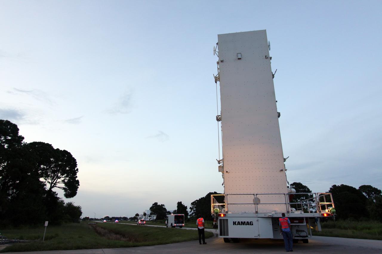 CAPE CANAVERAL, Fla. – The payload canister rolls to Launch Pad 39A at NASA's Kennedy Space Center in Florida. Inside is the payload for space shuttle Discovery and the STS-128 mission, the Multi-Purpose Logistics Module Leonardo and the Lightweight Multi-Purpose Experiment Support Structure Carrier. Discovery's 13-day flight will deliver a new crew member and 33,000 pounds of equipment to the International Space Station. The equipment includes science and storage racks, a freezer to store research samples, a new sleeping compartment and the COLBERT treadmill. Launch of Discovery on its STS-128 mission is targeted for August 25. Photo credit: NASA/Jack Pfaller.