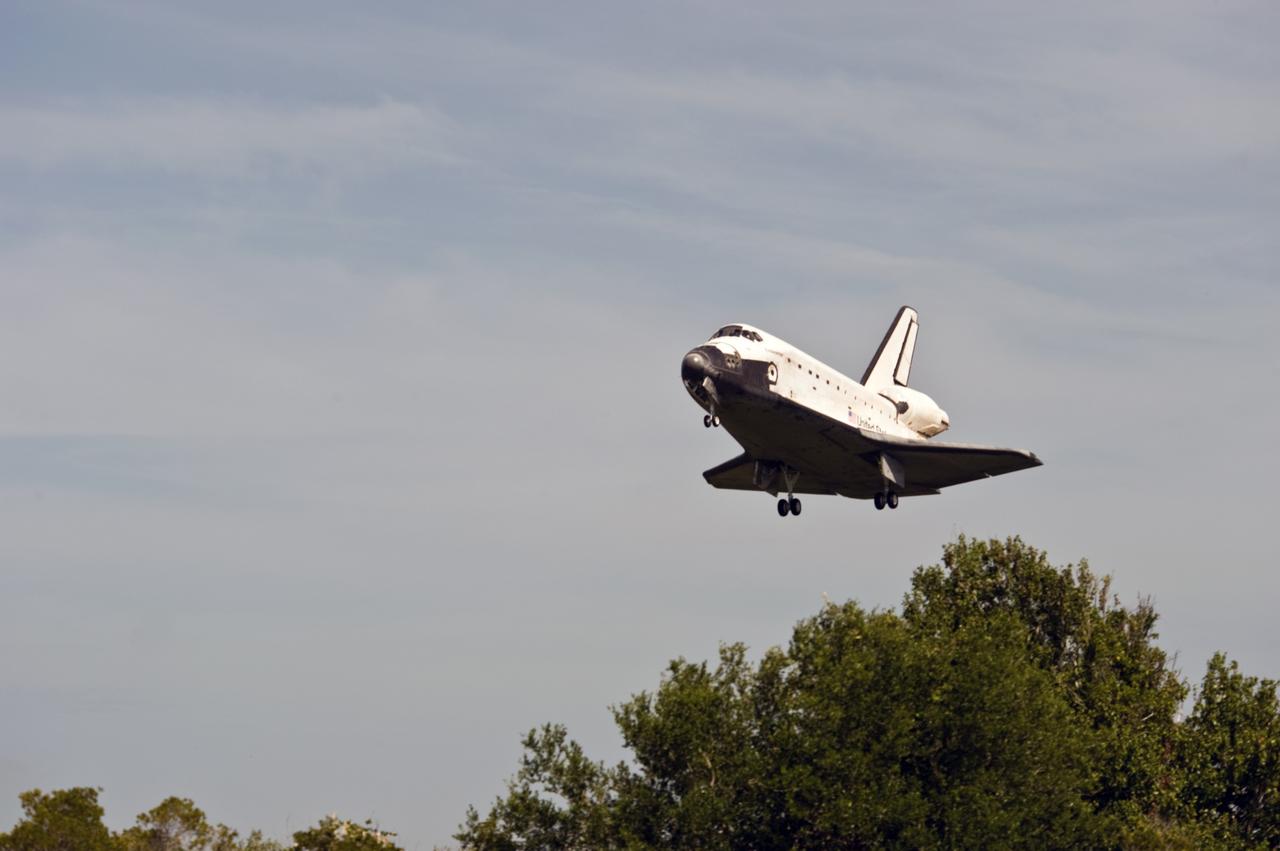 CAPE CANAVERAL, Fla. – Space shuttle Endeavour clears the trees as it heads for a landing on Runway 15 at NASA's Kennedy Space Center in Florida.  The landing completes Endeavour's 16-day, 6.5-million mile journey on the STS-127 mission to the International Space Station. Endeavour landed on orbit 248.   Main gear touchdown was at 10:48:08 a.m. EDT. Nose gear touchdown was at 10:48:21 a.m. and wheels stop was at 10:49:13 a.m. Endeavour delivered the Japanese Experiment Module's Exposed Facility and the Experiment Logistics Module-Exposed Section to the International Space Station. The mission was the 29th flight to the station, the 23rd flight of Endeavour and the 127th in the Space Shuttle Program, as well as the 71st landing at Kennedy.  Photo credit: NASA/Tony Gray