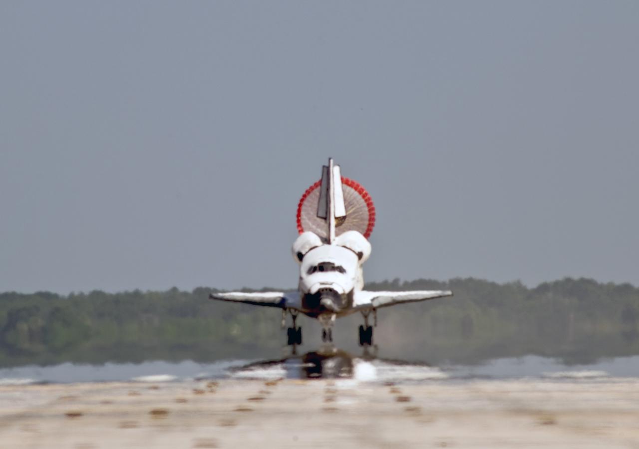 CAPE CANAVERAL, Fla. – The unfurled drogue chute slows space shuttle Endeavour as it lands on Runway 15 at NASA's Kennedy Space Center in Florida to complete the 16-day, 6.5-million mile journey on the STS-127 mission to the International Space Station. Endeavour landed on orbit 248.  Main gear touchdown was at 10:48:08 a.m. EDT. Nose gear touchdown was at 10:48:21 a.m. and wheels stop was at 10:49:13 a.m. Endeavour delivered the Japanese Experiment Module's Exposed Facility and the Experiment Logistics Module-Exposed Section to the International Space Station. The mission was the 29th flight to the station, the 23rd flight of Endeavour and the 127th in the Space Shuttle Program, as well as the 71st landing at Kennedy.  Photo credit: NASA/Tony Gray, Tom Farrar